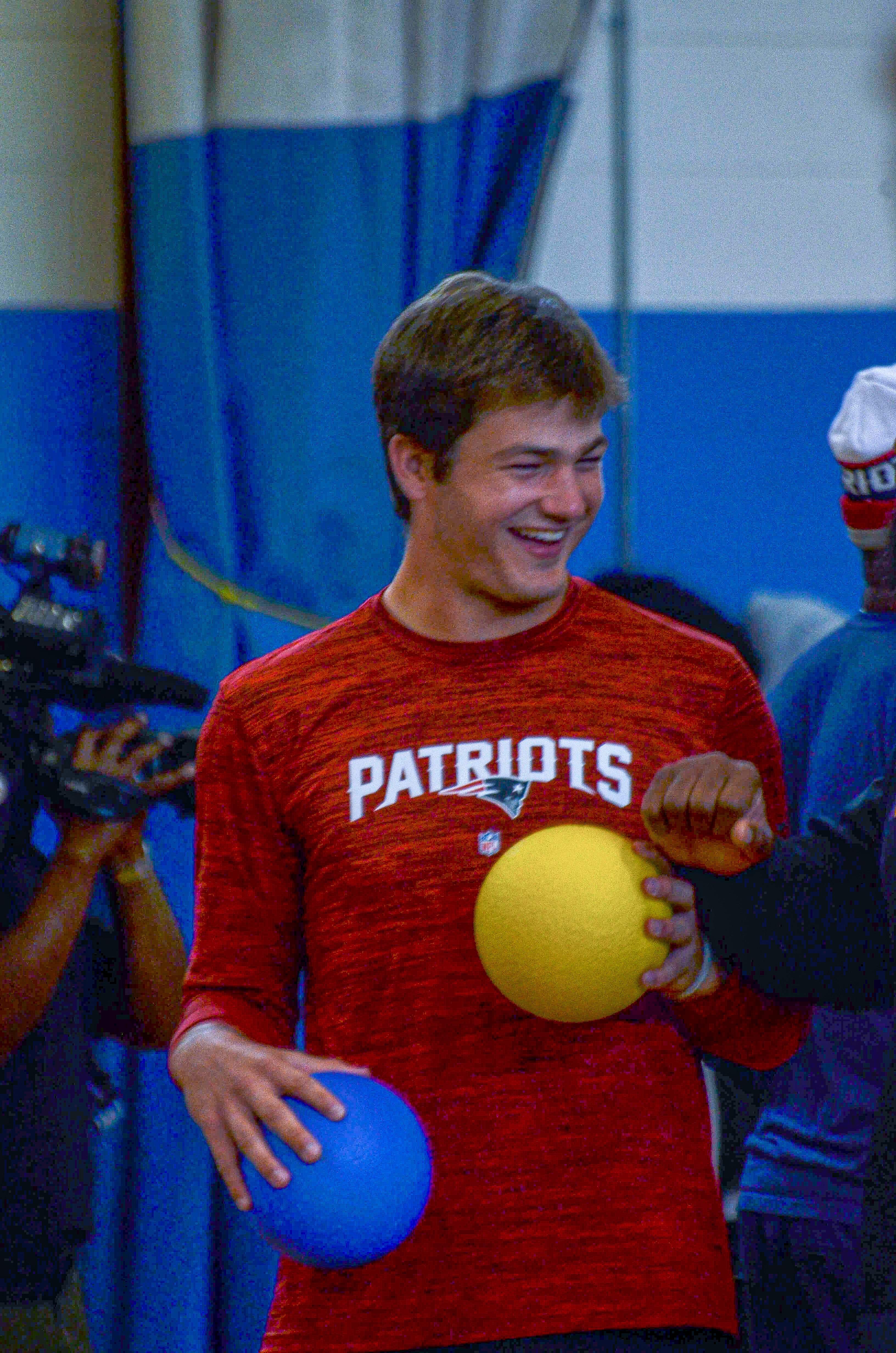 Quarterback Drake Maye laughs while playing dodgeball at the New England Patriots community event at the Perkins Community Center/Lee School - June 11, 2024
