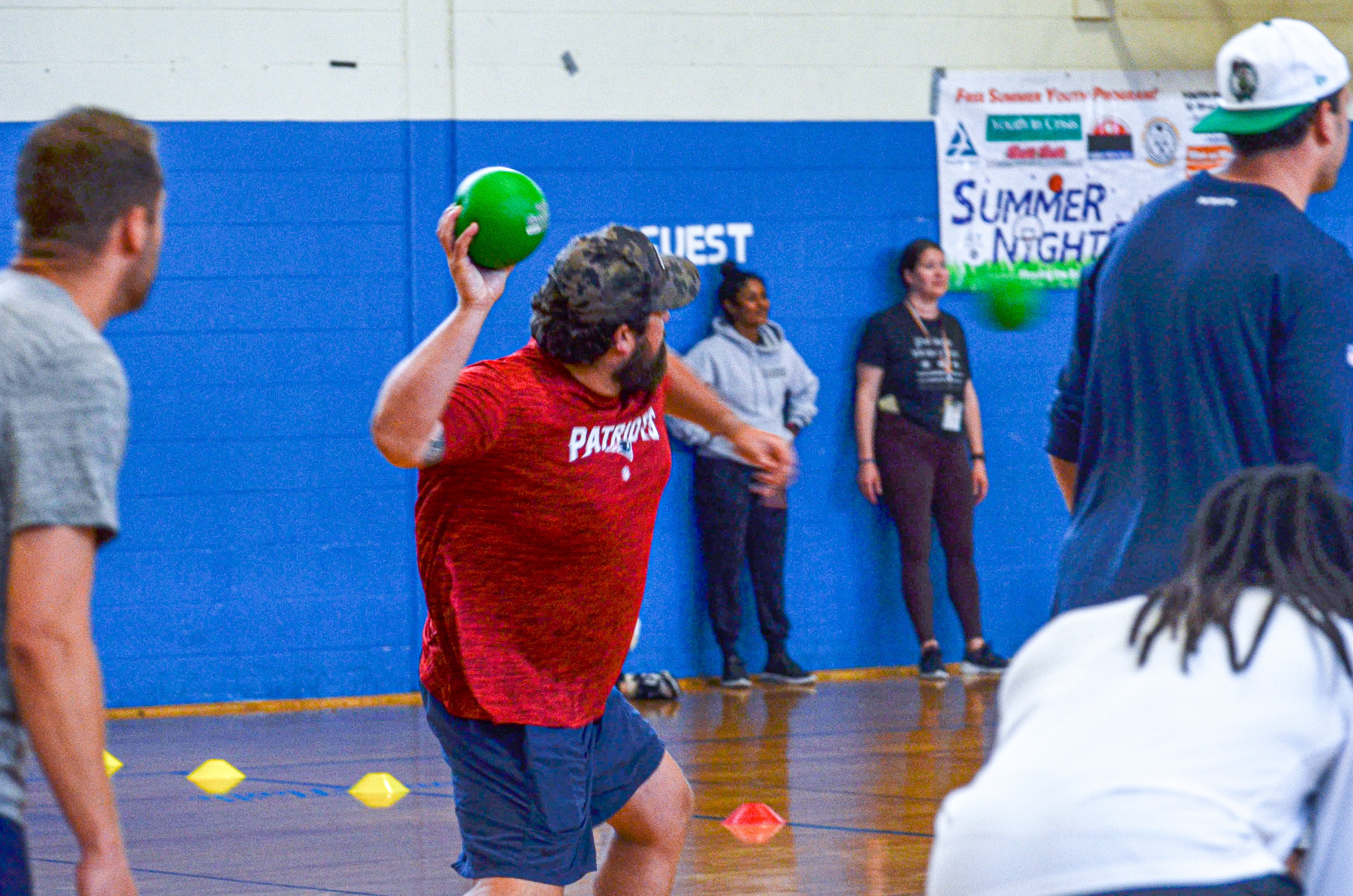 Center David Andrews plays dodgeball against students at the New England Patriots community event at the Perkins Community Center/Lee School - June 11, 2024