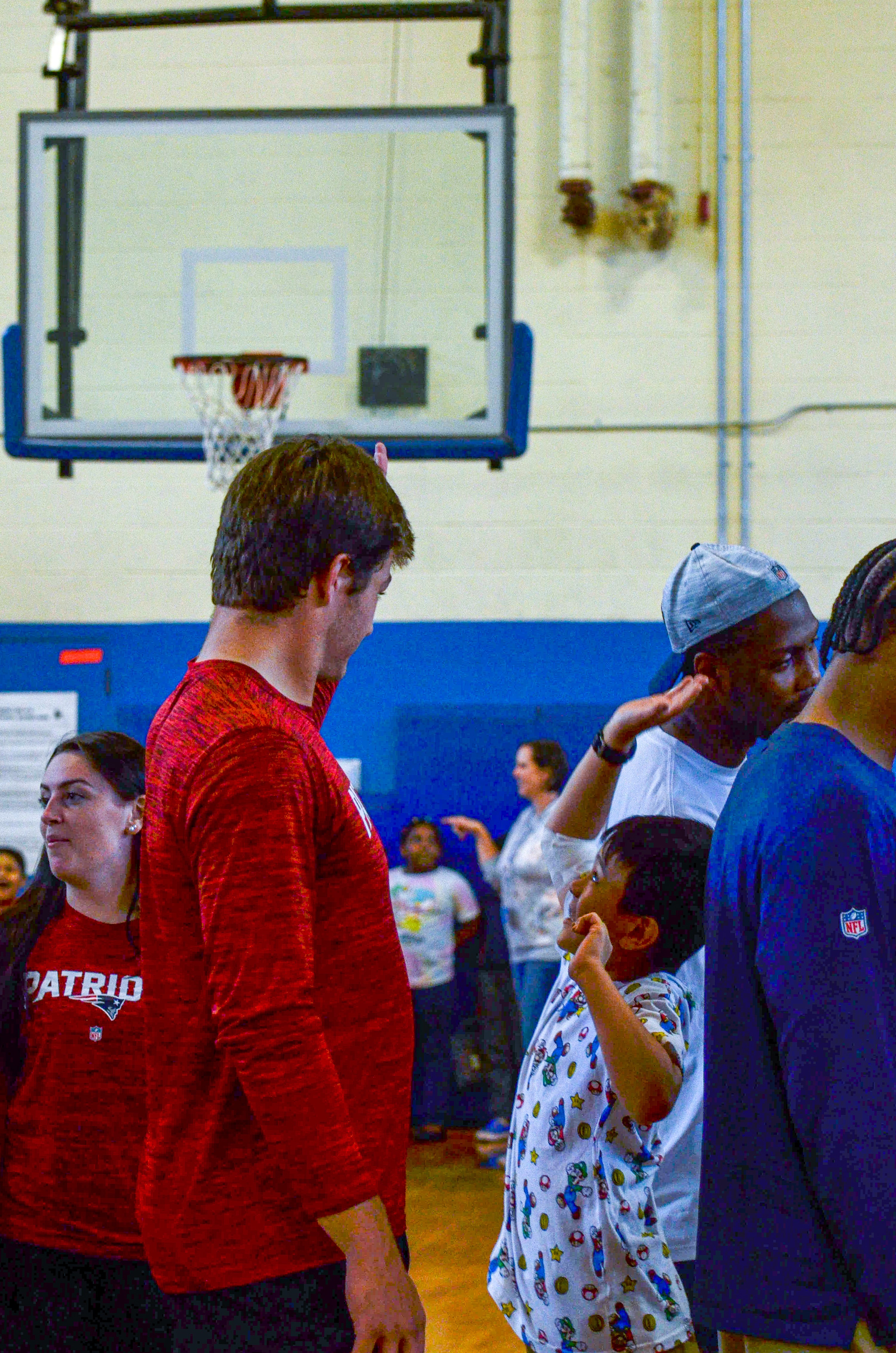 Quarterback Drake Maye greets the students at the New England Patriots community event at the Perkins Community Center/Lee School - June 11, 2024