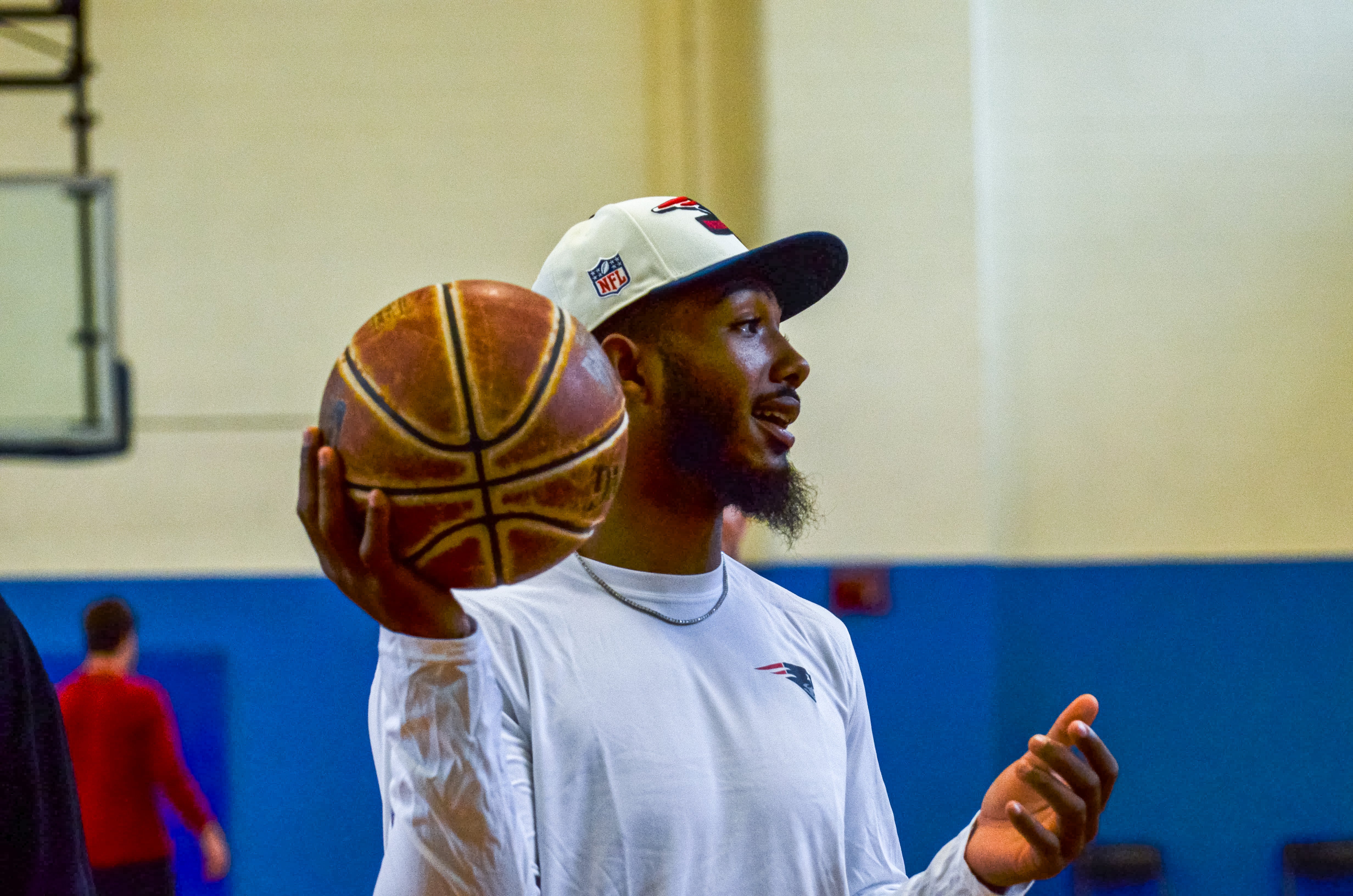 Wide receiver Ja'Lynn Polk plays basketball at the New England Patriots community event at the Perkins Community Center/Lee School - June 11, 2024