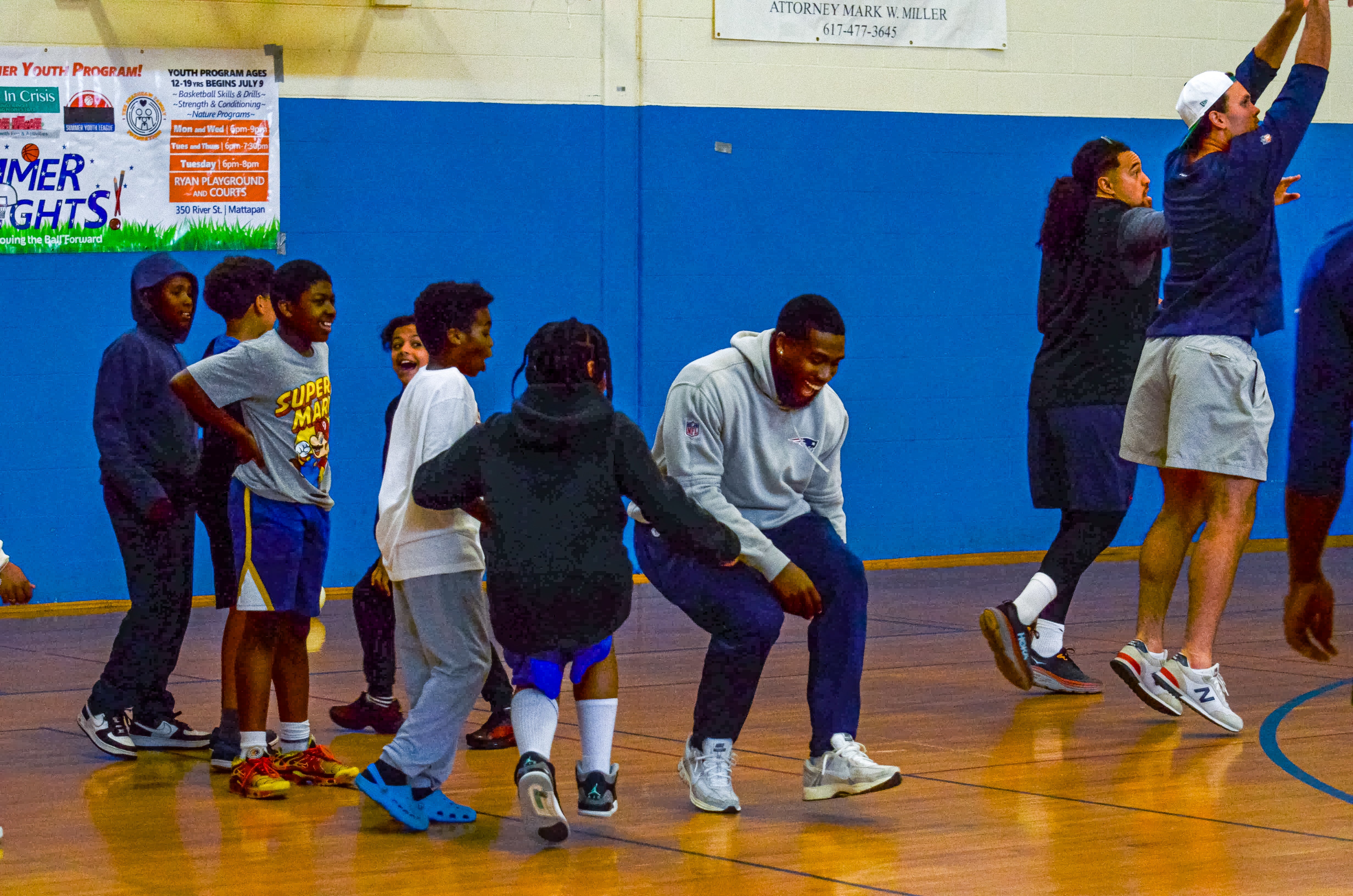A player dances with the students during the New England Patriots community event at the Perkins Community Center/Lee School - June 11, 2024