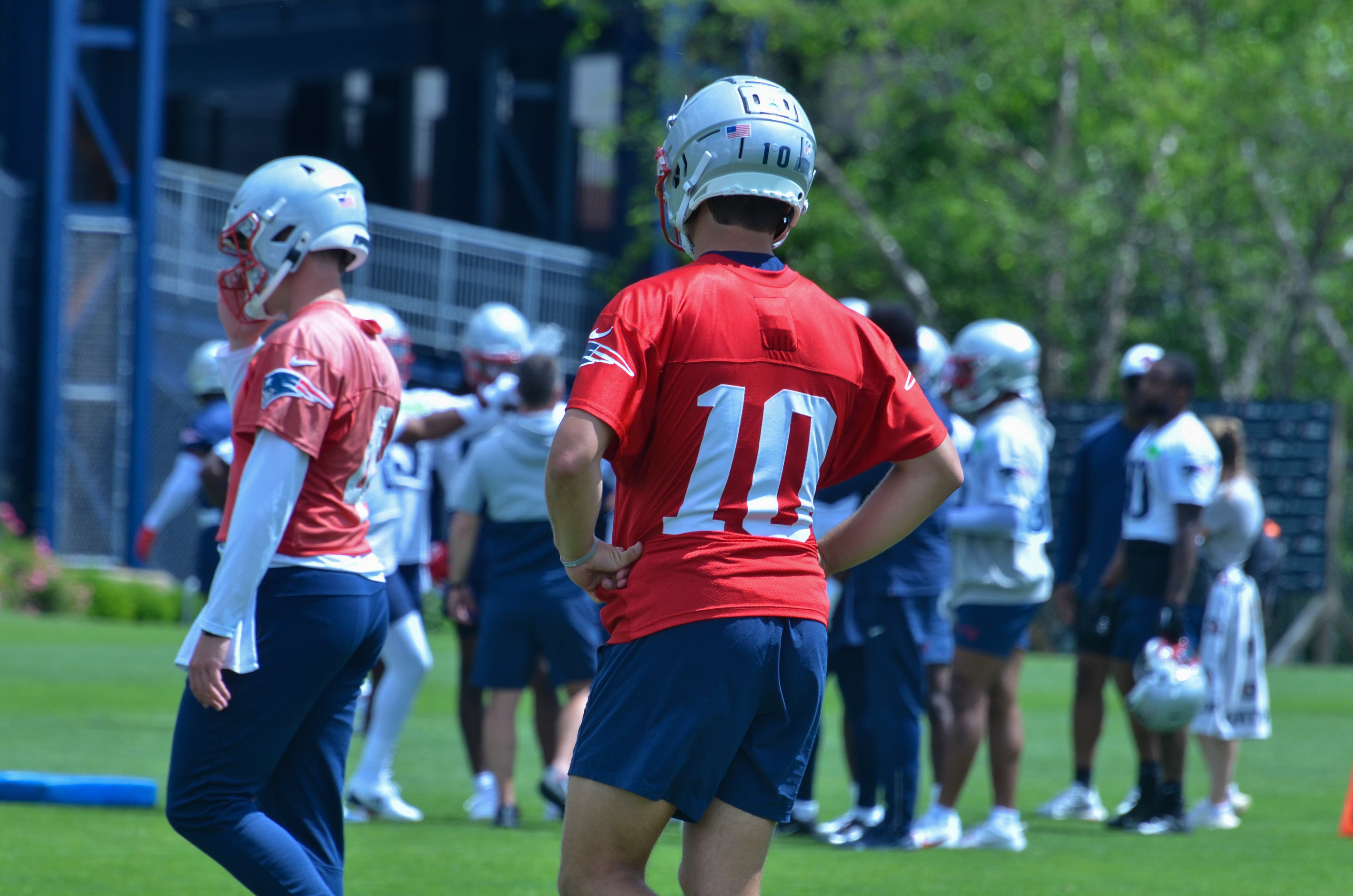 Patriots QB Drake Maye and Bailey Zappe during the team's final day of mandatory minicamp - June 12, 2024