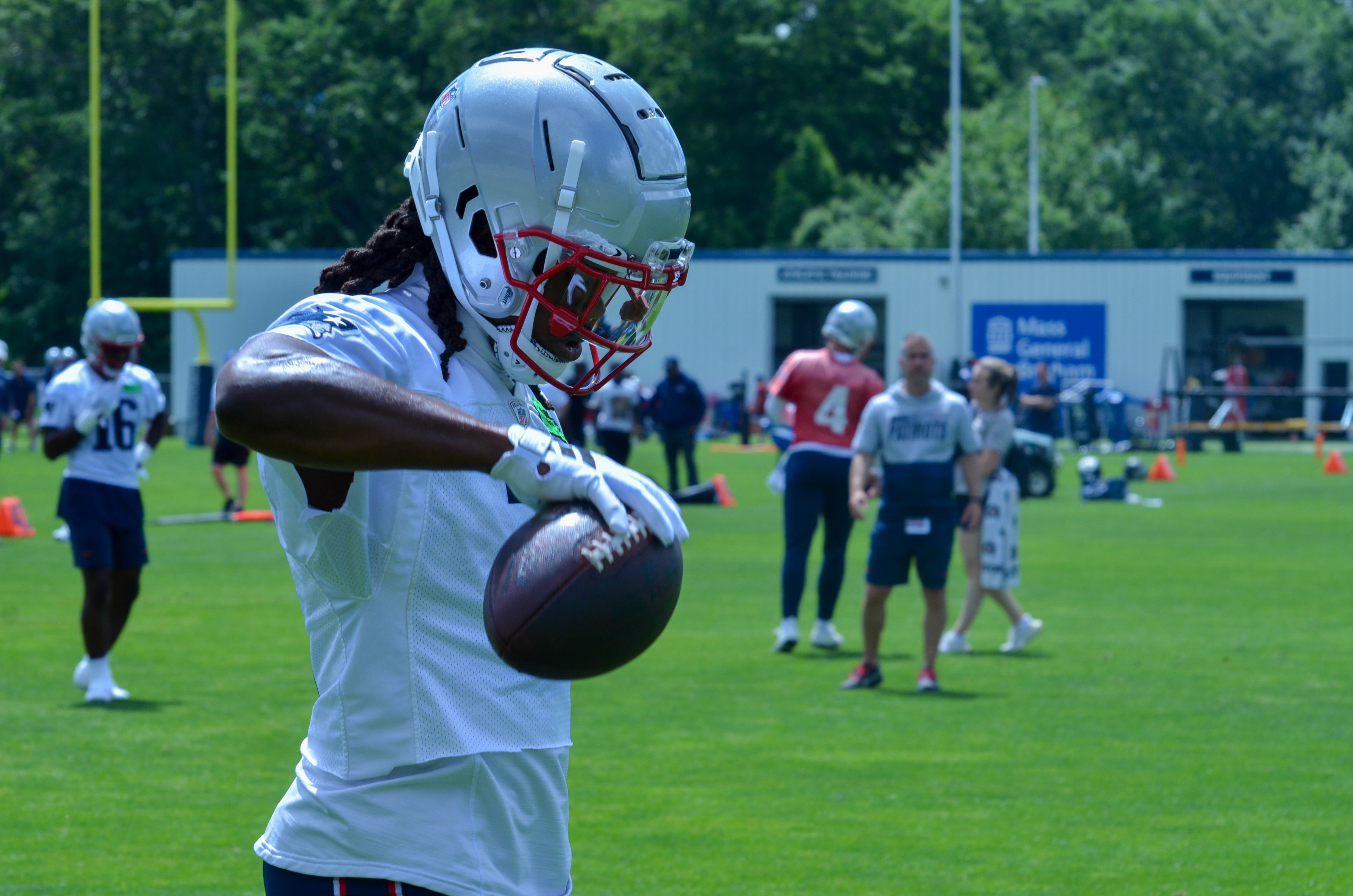 Patriots WR K.J. Osborn holds the ball after completing a pass during the team's final day of mandatory minicamp - June 12, 2024