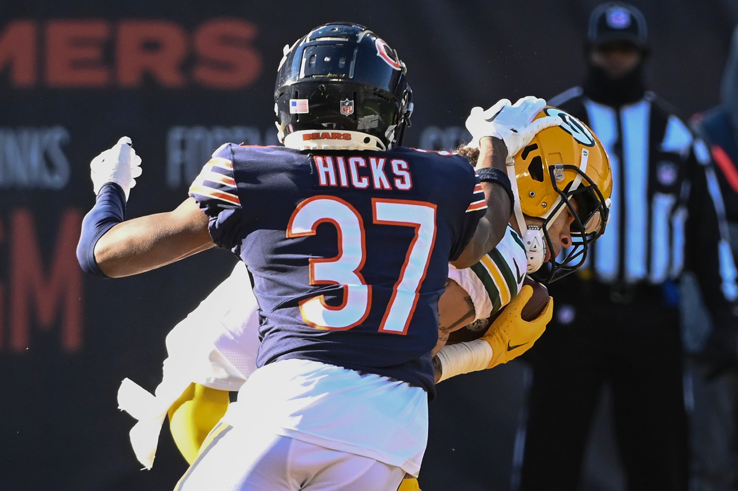 Dec 4, 2022; Chicago, Illinois, USA; Green Bay Packers wide receiver Christian Watson (9) catches a pass for a touchdown against Chicago Bears safety Elijah Hicks (37) during the first half at Soldier Field.