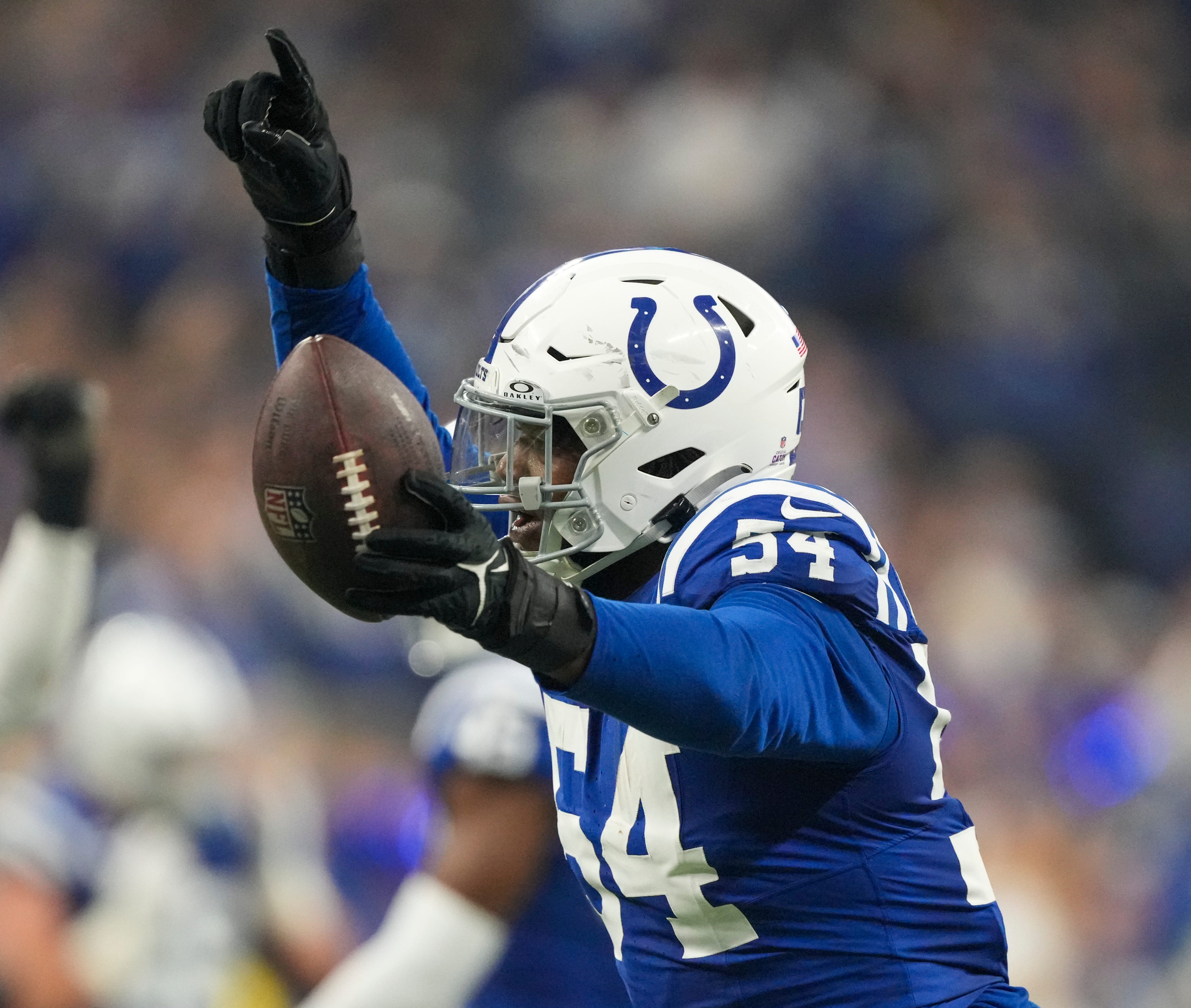 Indianapolis Colts defensive end Dayo Odeyingbo (54) celebrates a fumble recovery against The New Orleans Saints, Sunday., Oct 29, 2023, at Lucas Oil Stadium in Indianapolis.