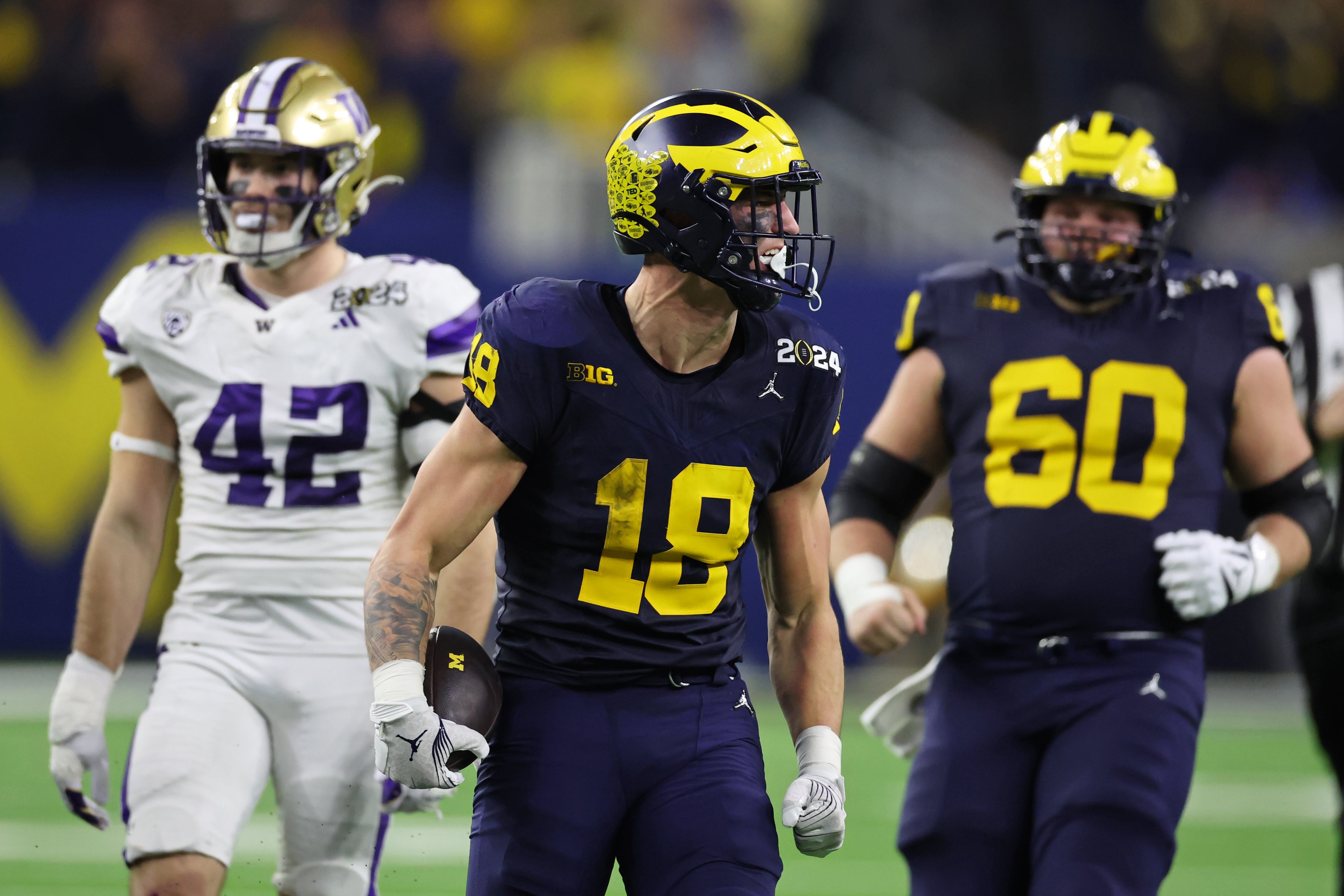 Jan 8, 2024; Houston, TX, USA; Michigan Wolverines tight end Colston Loveland (18) celebrates after making a catch against the Washington Huskies during the fourth quarter in the 2024 College Football Playoff national championship game at NRG Stadium.
