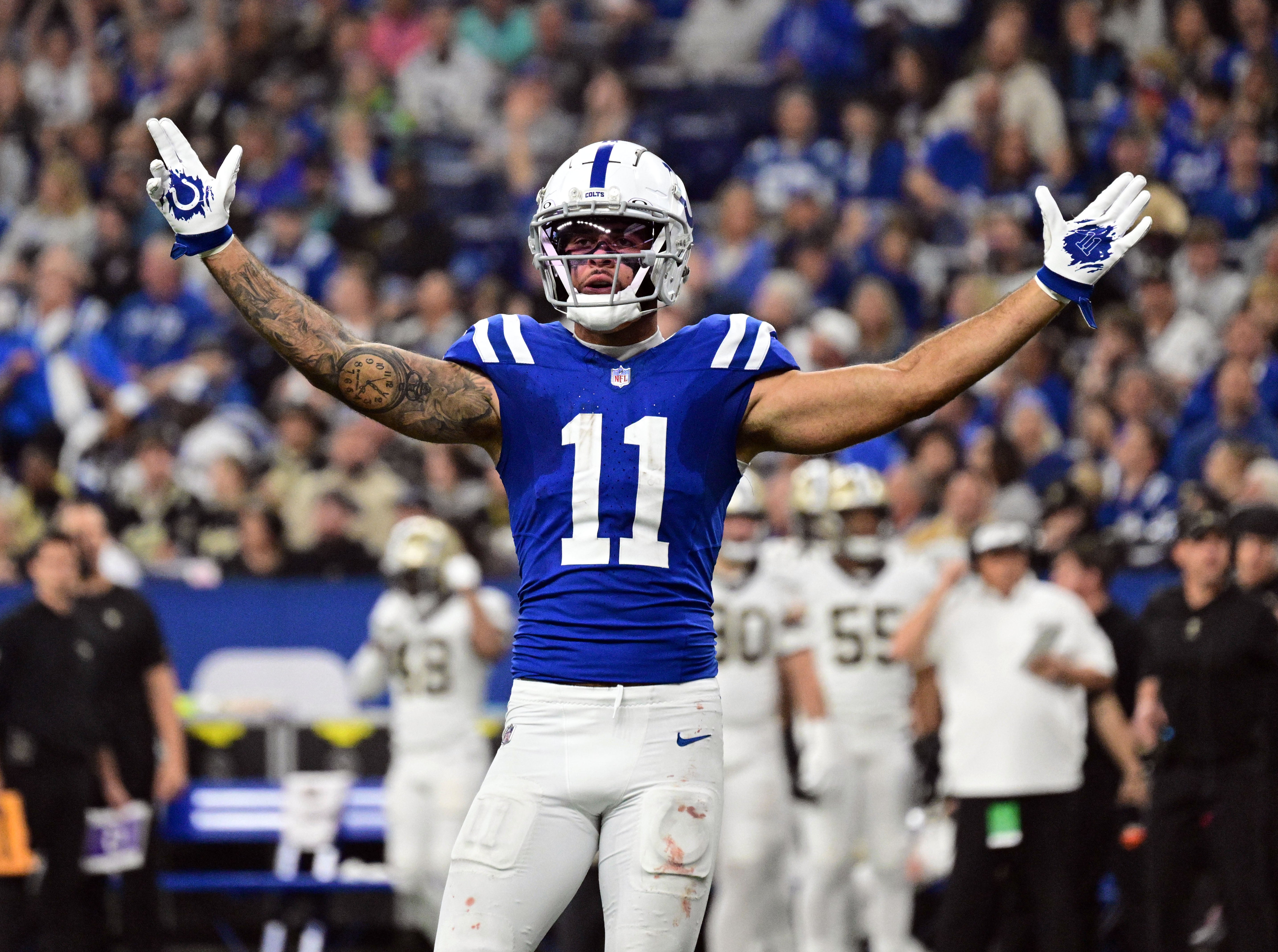 Oct 29, 2023; Indianapolis, Indiana, USA; Indianapolis Colts wide receiver Michael Pittman Jr. (11) celebrates during the first half of the game against the New Orleans Saints at Lucas Oil Stadium.