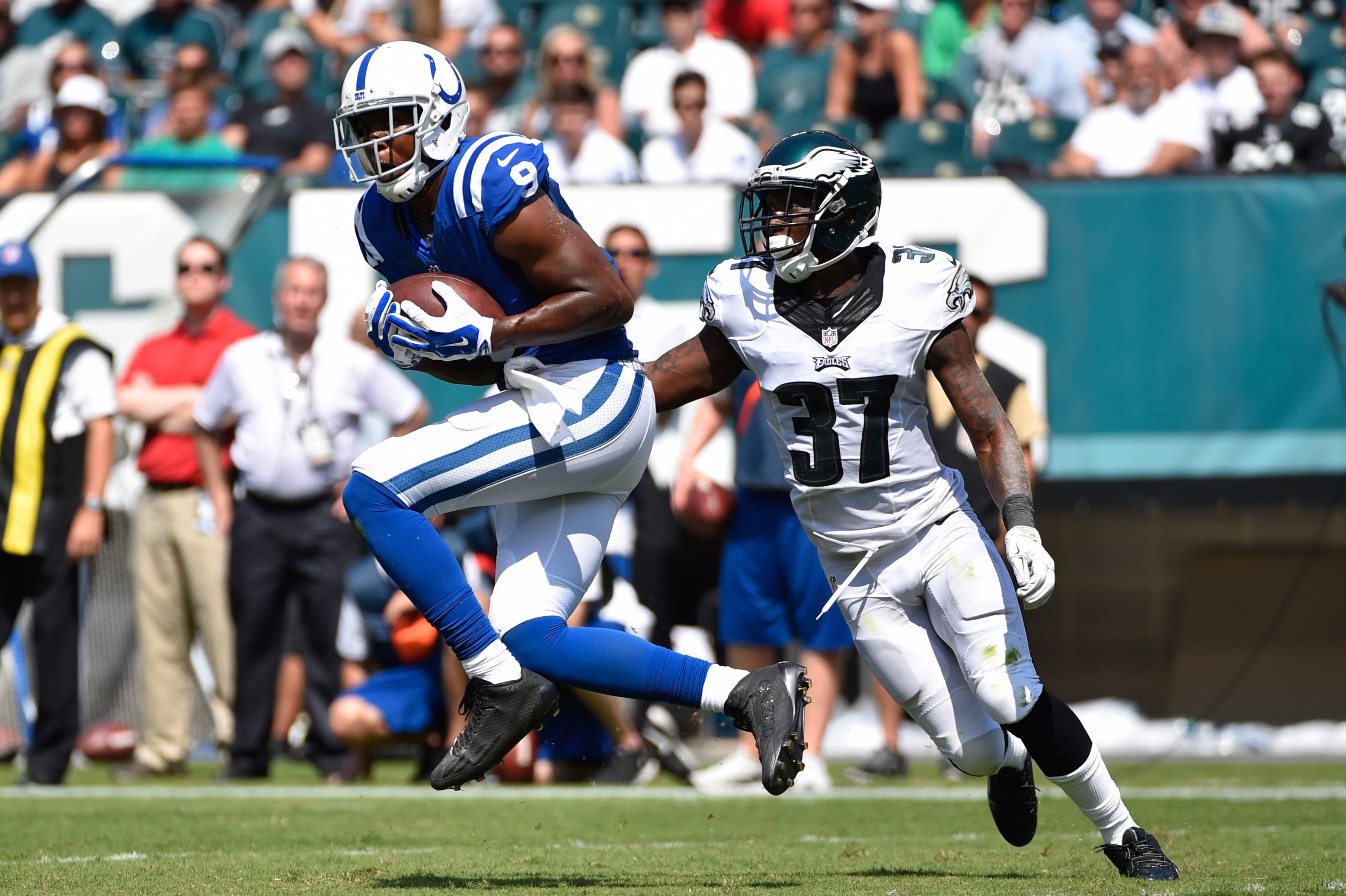 Aug 16, 2015; Philadelphia, PA, USA; Indianapolis Colts wide receiver Duron Carter (9) makes a catch past Philadelphia Eagles cornerback Jaylen Watkins (37) during a preseason NFL football game at Lincoln Financial Field.