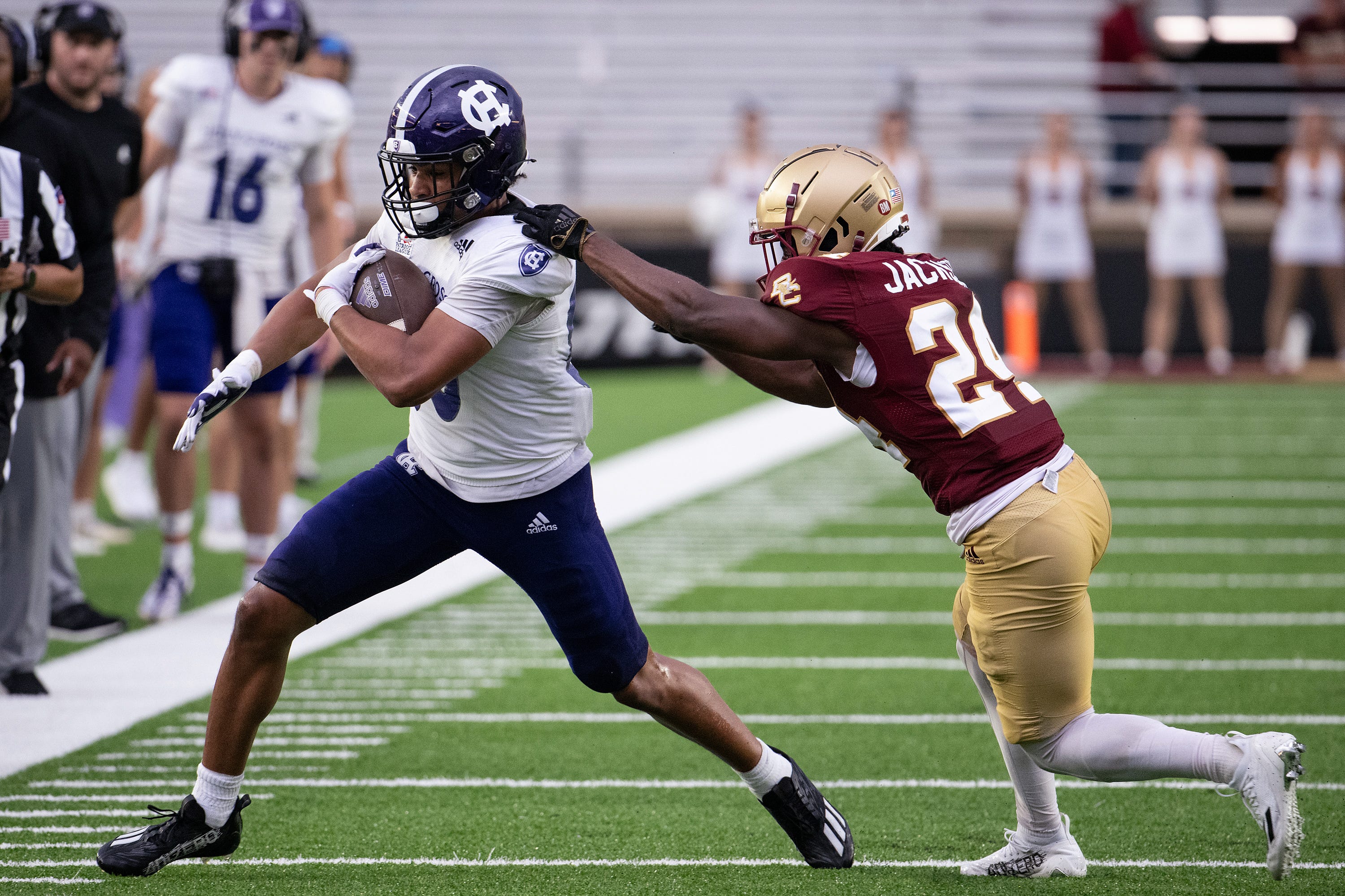 After play resumed Holy Cross s Jalen Coker runs out of bounds while Boston College s Amari Jackson pursues on Saturday September 9, 2023 at Alumni Stadium in Newton.