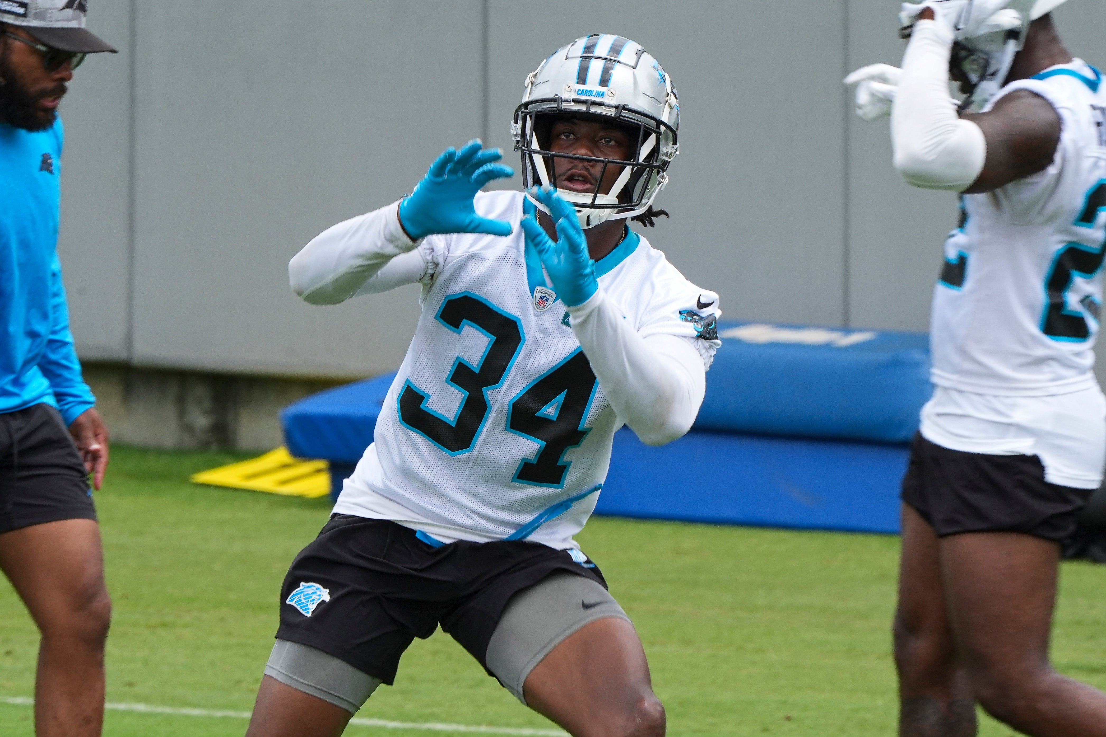 Jun 4, 2024; Charlotte, NC, USA; Carolina Panthers cornerback Willie Drew (34) makes a catch during OTAs. Mandatory Credit: Jim Dedmon-USA TODAY Sports
