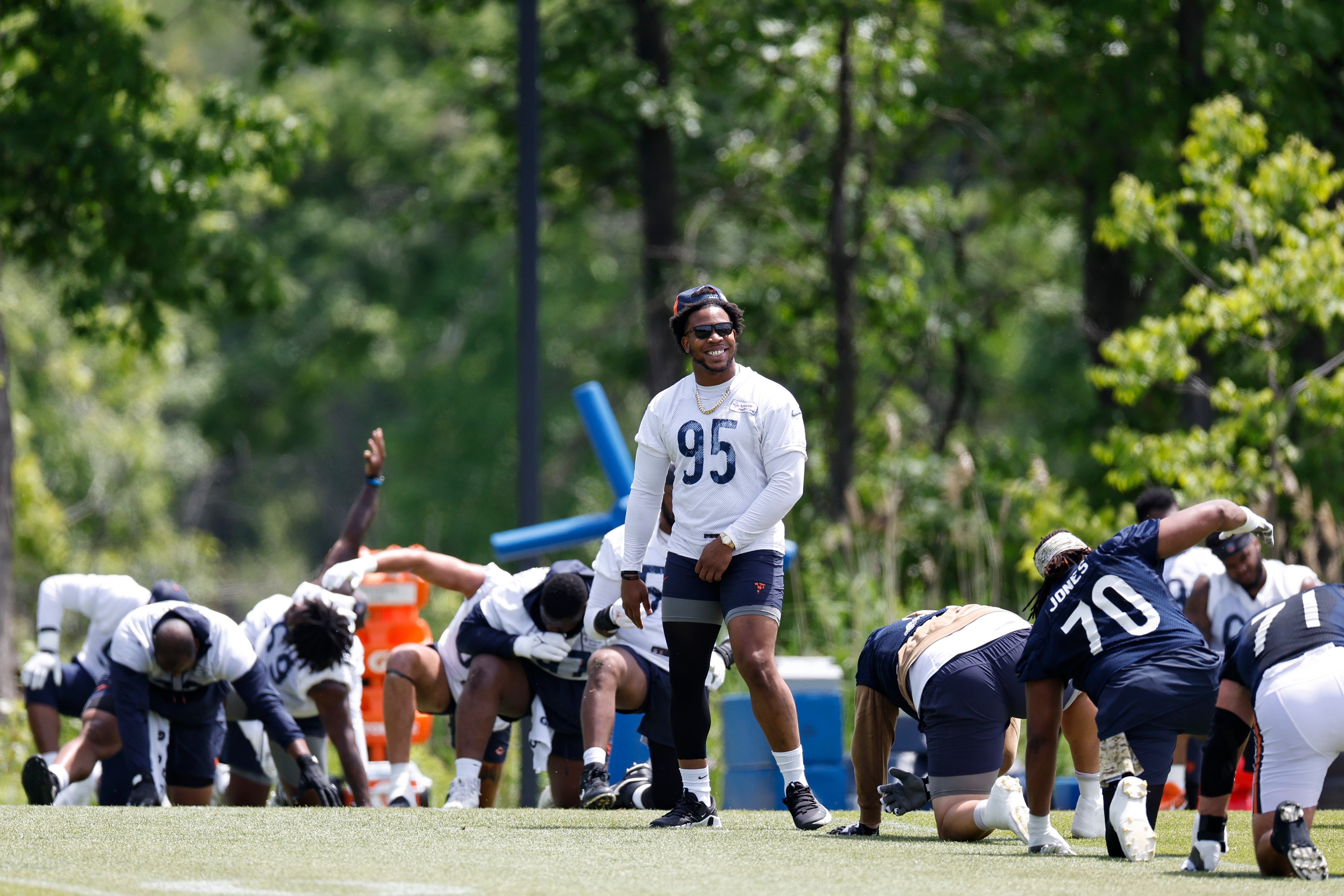 May 31, 2024; Lake Forest, IL, USA; Chicago Bears defensive end DeMarcus Walker (95) smiles during organized team activities at Halas Hall.