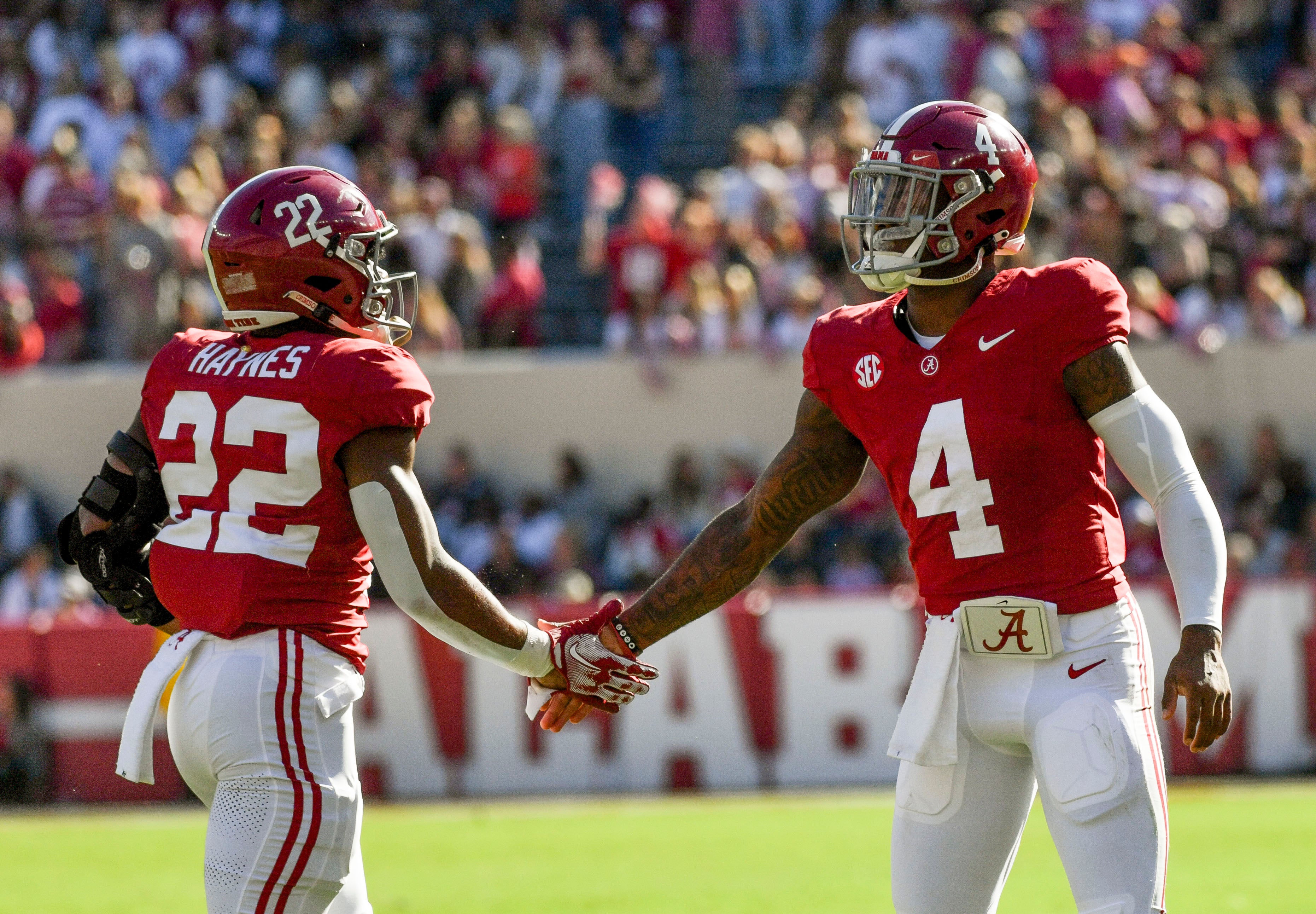 Nov 18, 2023; Tuscaloosa, Alabama, USA; Alabama Crimson Tide running back Justice Haynes (22) celebrates with quarterback Jalen Milroe (4) after scoring a touchdown against the Chattanooga Mocs at Bryant-Denny Stadium. Alabama won 66-10. Mandatory Credit: Gary Cosby Jr.-USA TODAY Sports  