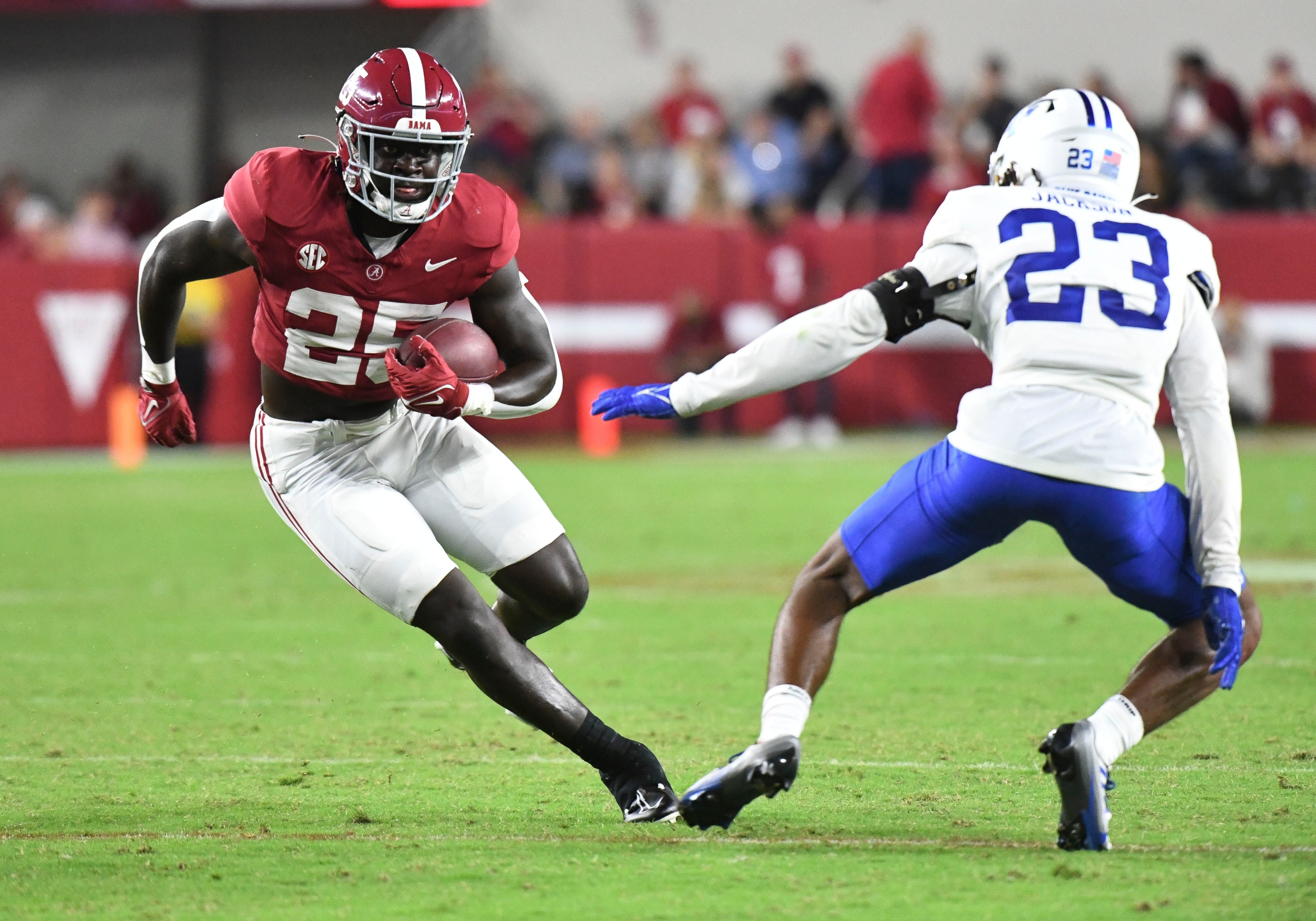 Sep 2, 2023; Tuscaloosa, Alabama, USA; Alabama Crimson Tide running back Richard Young (25) runs the ball against Middle Tennessee Blue Raiders cornerback Jalen Jackson (23) during the second half at Bryant-Denny Stadium. Alabama won 56-7. Mandatory Credit: Gary Cosby Jr.-USA TODAY Sports  