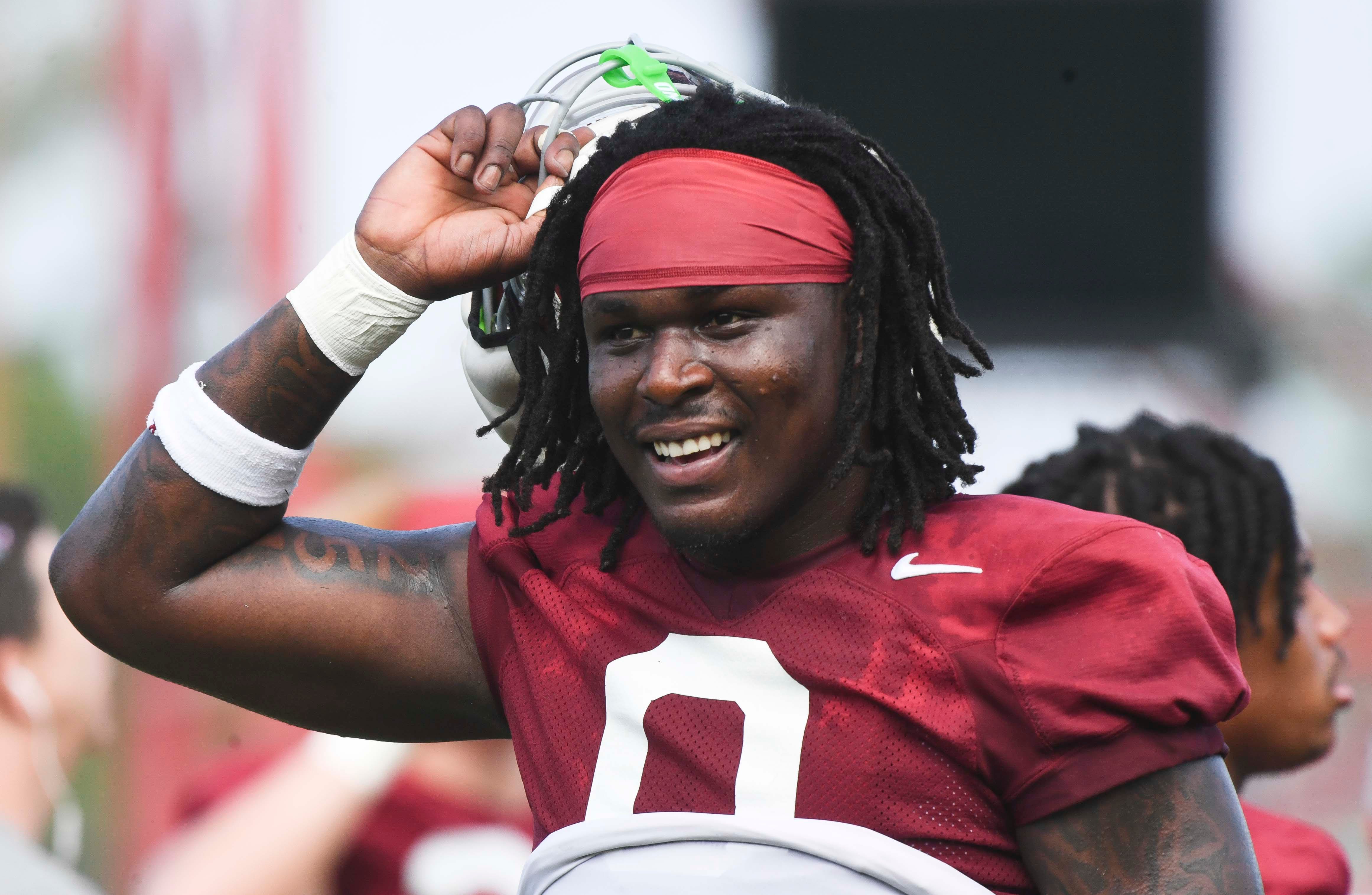 The Crimson Tide football team continued practice Thursday, Aug. 1, 2024, as they prepare for the season opener and the first game under new head coach Kalen DeBoer. Alabama linebacker Deontae Lawson (0) is all smiles during a short break for water.  