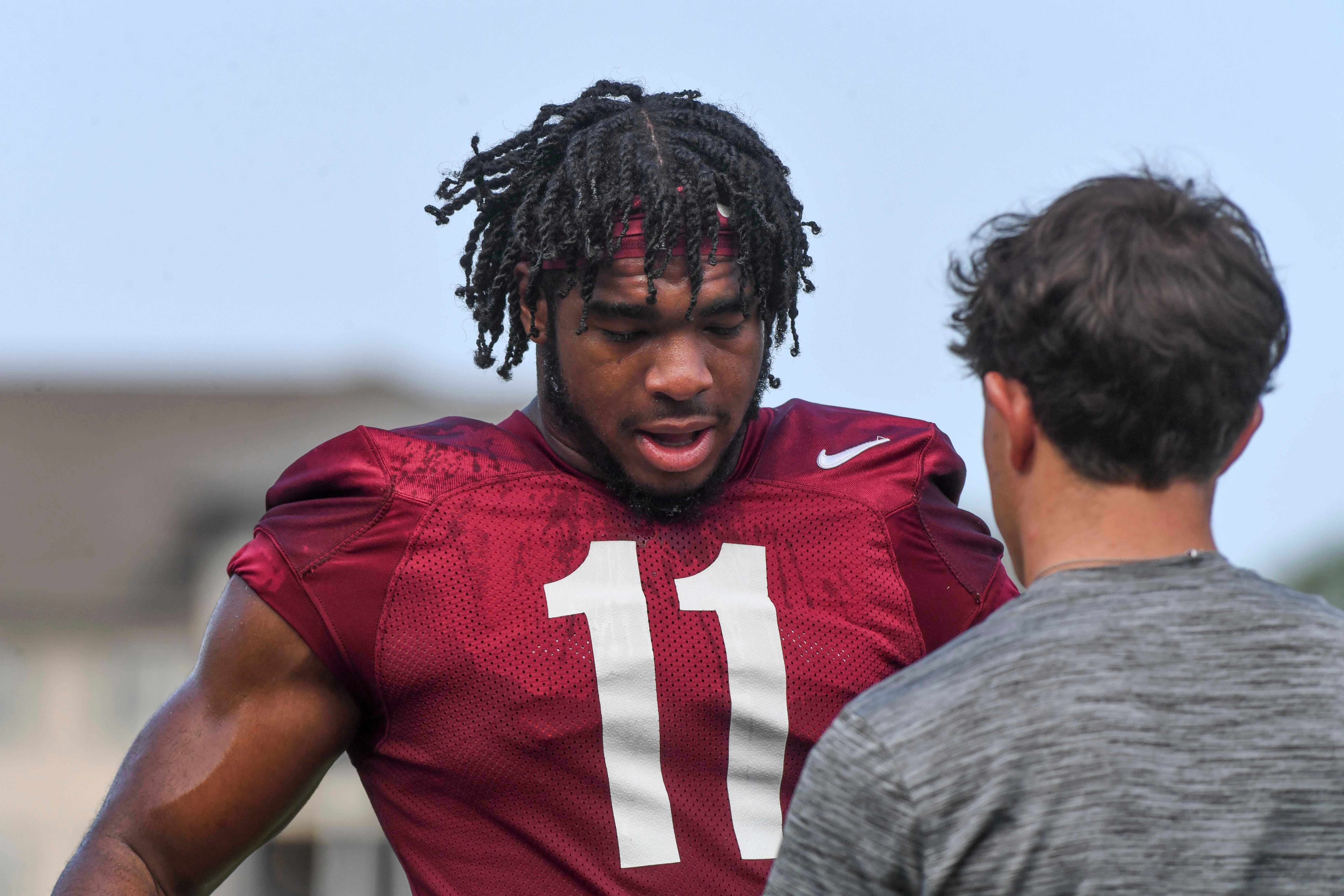The Crimson Tide football team continued practice Thursday, Aug. 1, 2024, as they prepare for the season opener and the first game under new head coach Kalen DeBoer. Alabama linebacker Jihaad Campbell (11) cools down during a break.  