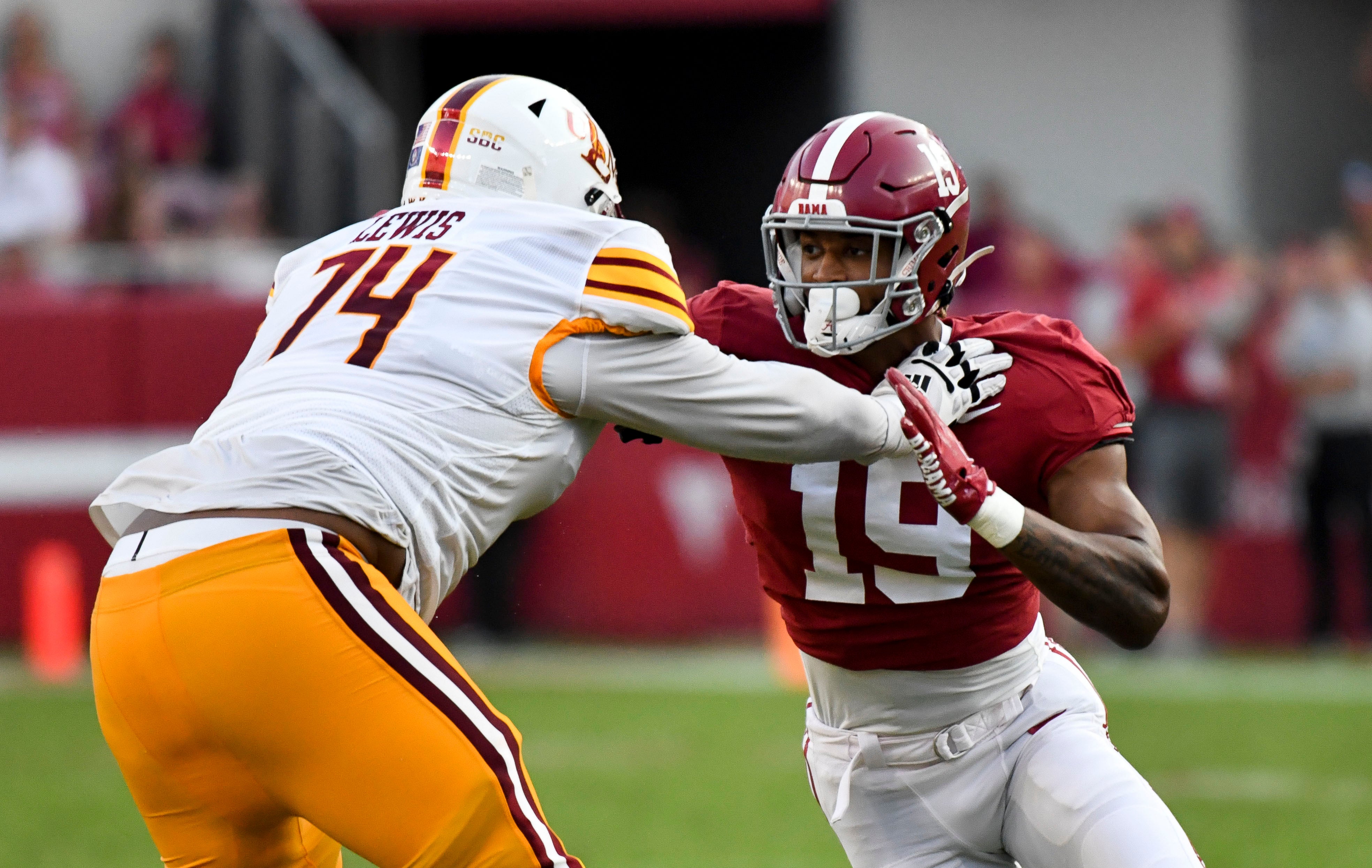 Sep 17, 2022; Tuscaloosa, Alabama, USA; UL Monroe Warhawks offensive lineman Keydrell Lewis (74) blocks against Alabama Crimson Tide linebacker Keanu Koht (19) at Bryant-Denny Stadium. Alabama won 63-7. Mandatory Credit: Gary Cosby Jr.-USA TODAY Sports  