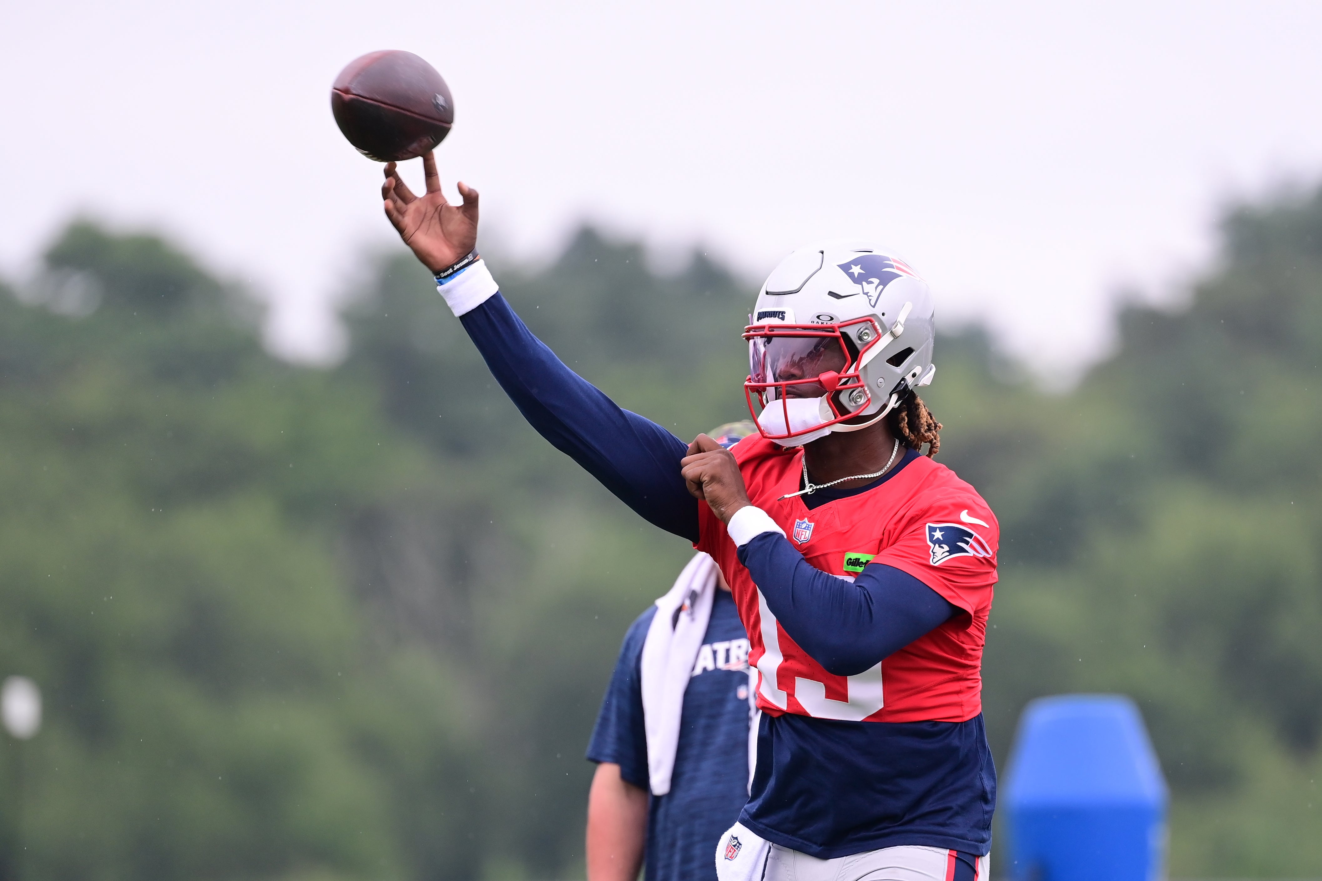 Jul 24, 2024; Foxborough, MA, USA; New England Patriots quarterback Joe Milton III (19) throws a pass during training camp at Gillette Stadium.