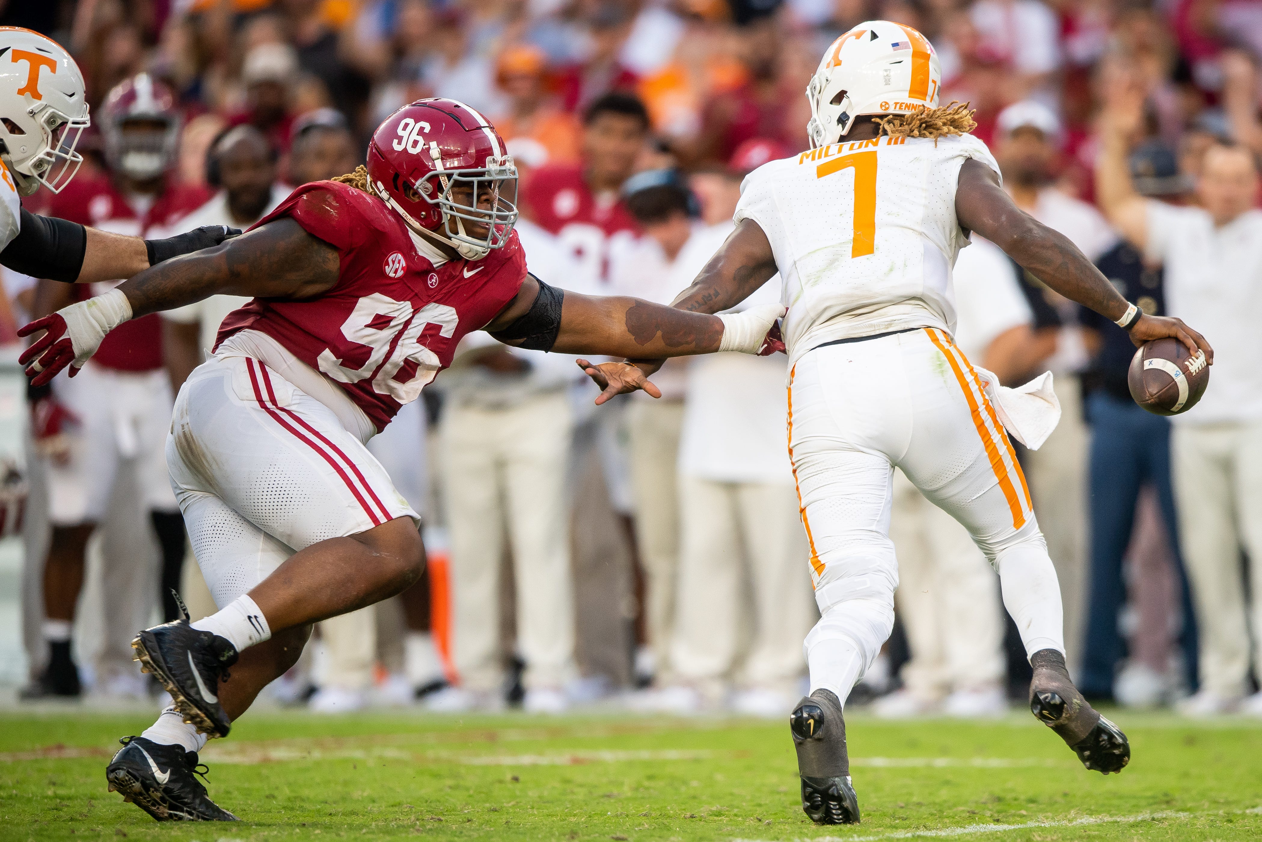 Alabama defensive lineman Tim Keenan III (96) chases after Tennessee quarterback Joe Milton III (7) during a football game between Tennessee and Alabama at Bryant-Denny Stadium in Tuscaloosa, Ala., on Saturday, Oct. 21, 2023.  
