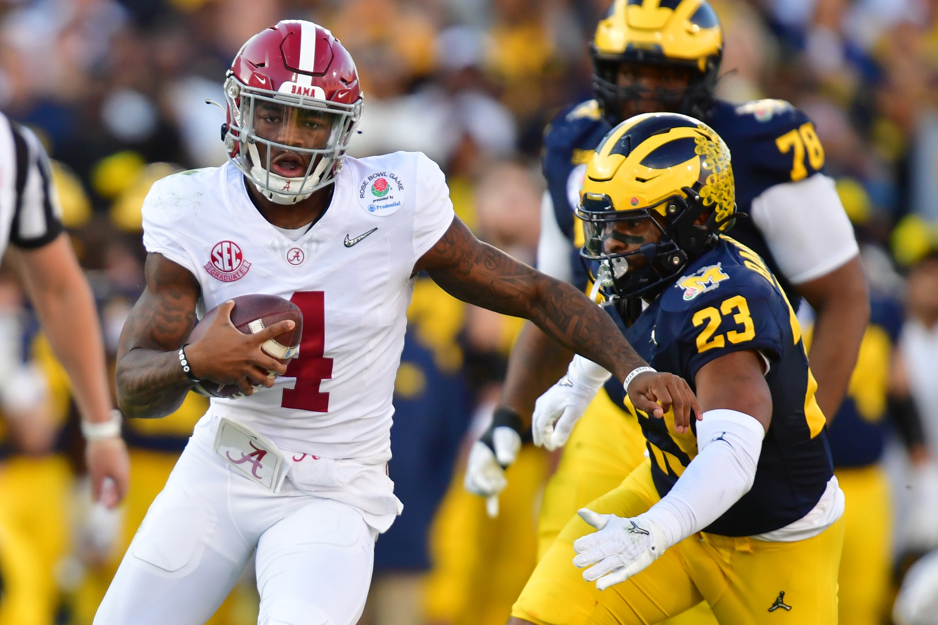 Jan 1, 2024; Pasadena, CA, USA; Alabama Crimson Tide quarterback Jalen Milroe (4) runs against Michigan Wolverines linebacker Michael Barrett (23) in the second quarter in the 2024 Rose Bowl college football playoff semifinal game at Rose Bowl. Mandatory Credit: Gary A. Vasquez-USA TODAY Sports  