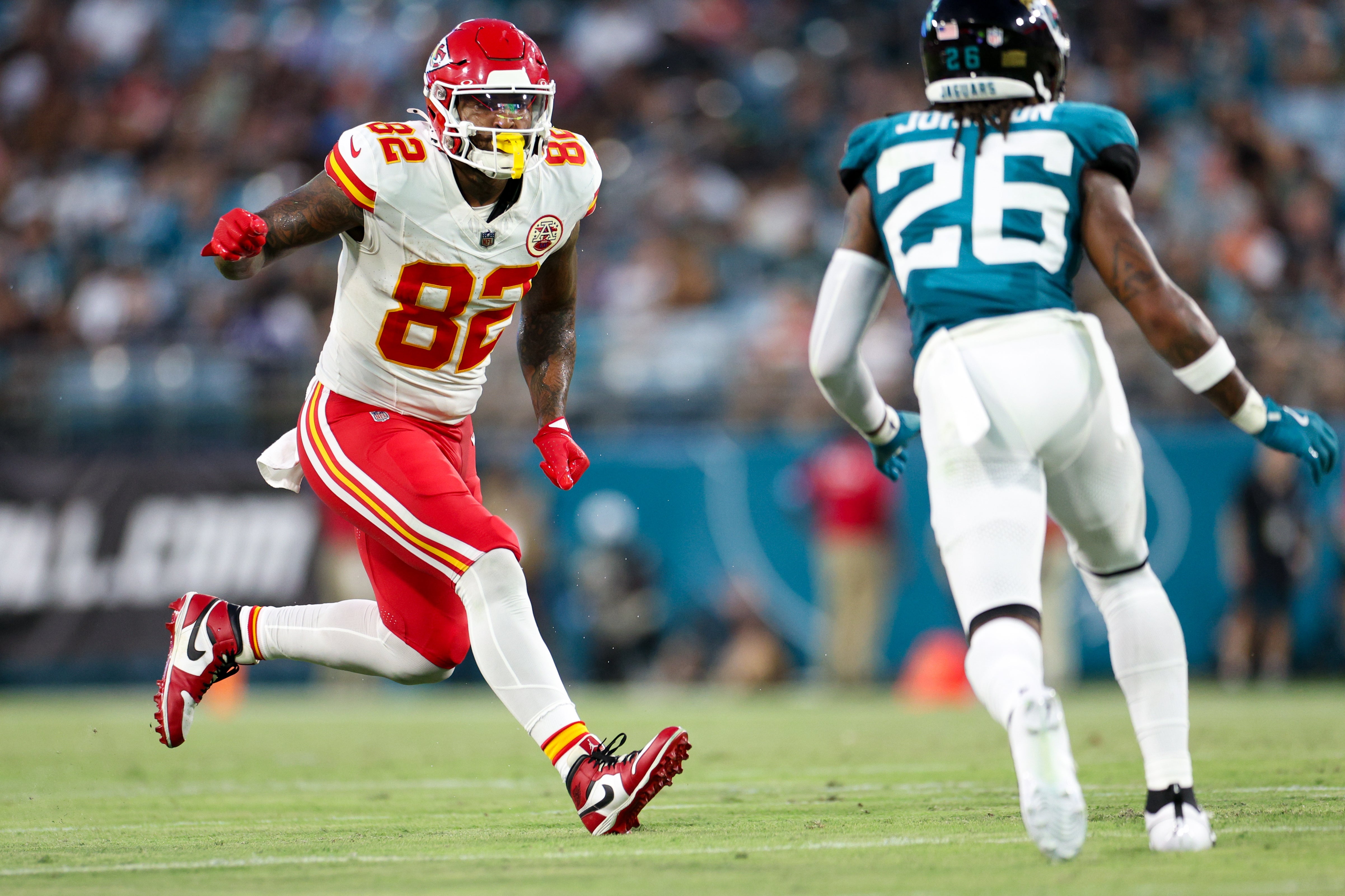 Aug 10, 2024; Jacksonville, Florida, USA; Kansas City Chiefs tight end Irv Smith (82) lines up against Jacksonville Jaguars safety Antonio Johnson (26) in the first quarter during preseason at EverBank Stadium.