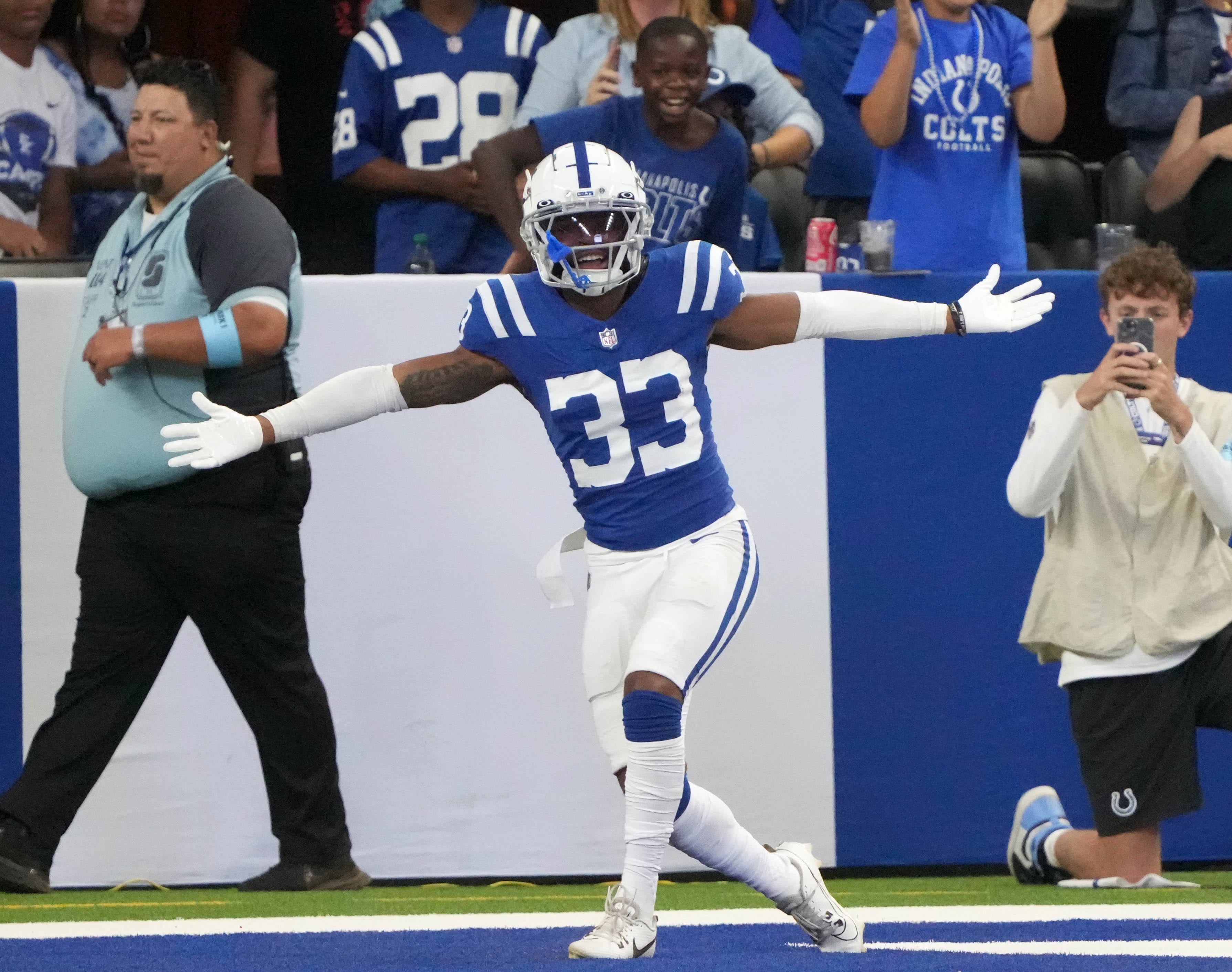 Indianapolis Colts cornerback Micah Abraham (33) celebrates after he scores a touchdown after intercepting a ball during the second half of a preseason game against the Denver Broncos on Sunday, Aug. 11, 2024, at Lucas Oil Stadium in Indianapolis. The Broncos defeated the Colts 34-30.