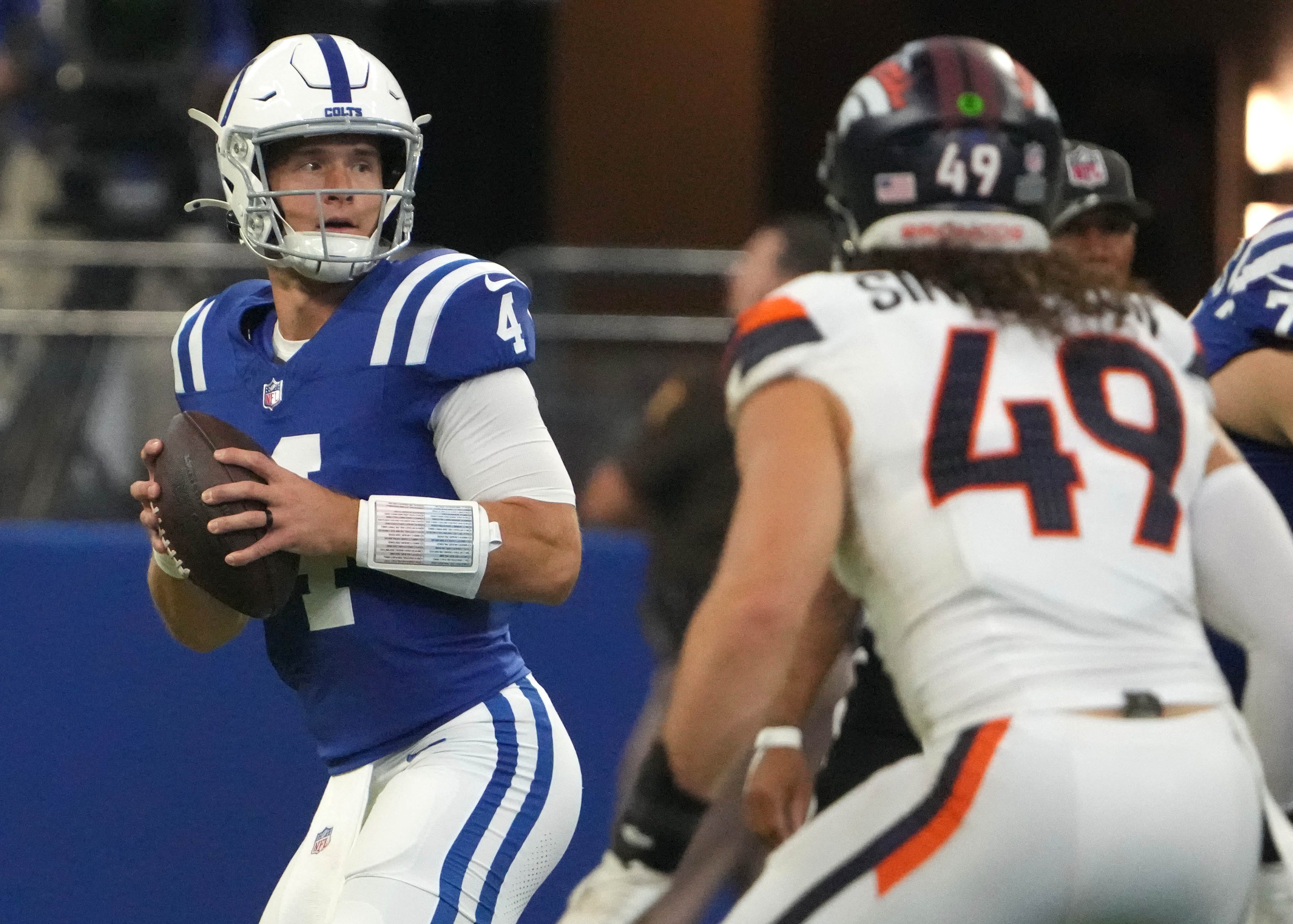 Indianapolis Colts quarterback Sam Ehlinger (4) throws a pass during the second half of a preseason game against the Denver Broncos on Sunday, Aug. 11, 2024, at Lucas Oil Stadium in Indianapolis. The Broncos defeated the Colts 34-30