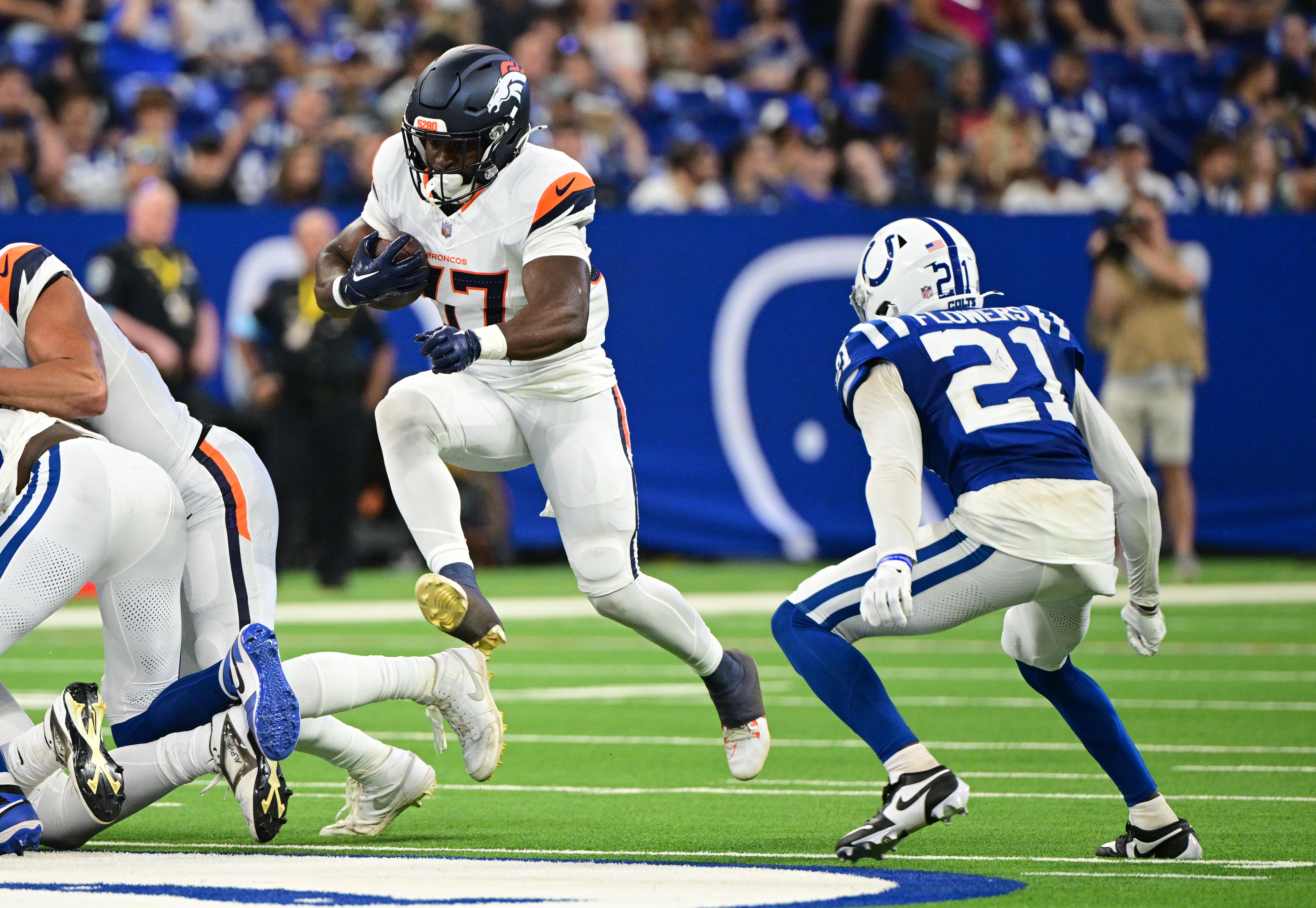 Aug 11, 2024; Indianapolis, Indiana, USA; Indianapolis Colts cornerback Ameer Speed (37) jumps to get past Indianapolis Colts cornerback Dallis Flowers (21) during the second quarter at Lucas Oil Stadium.