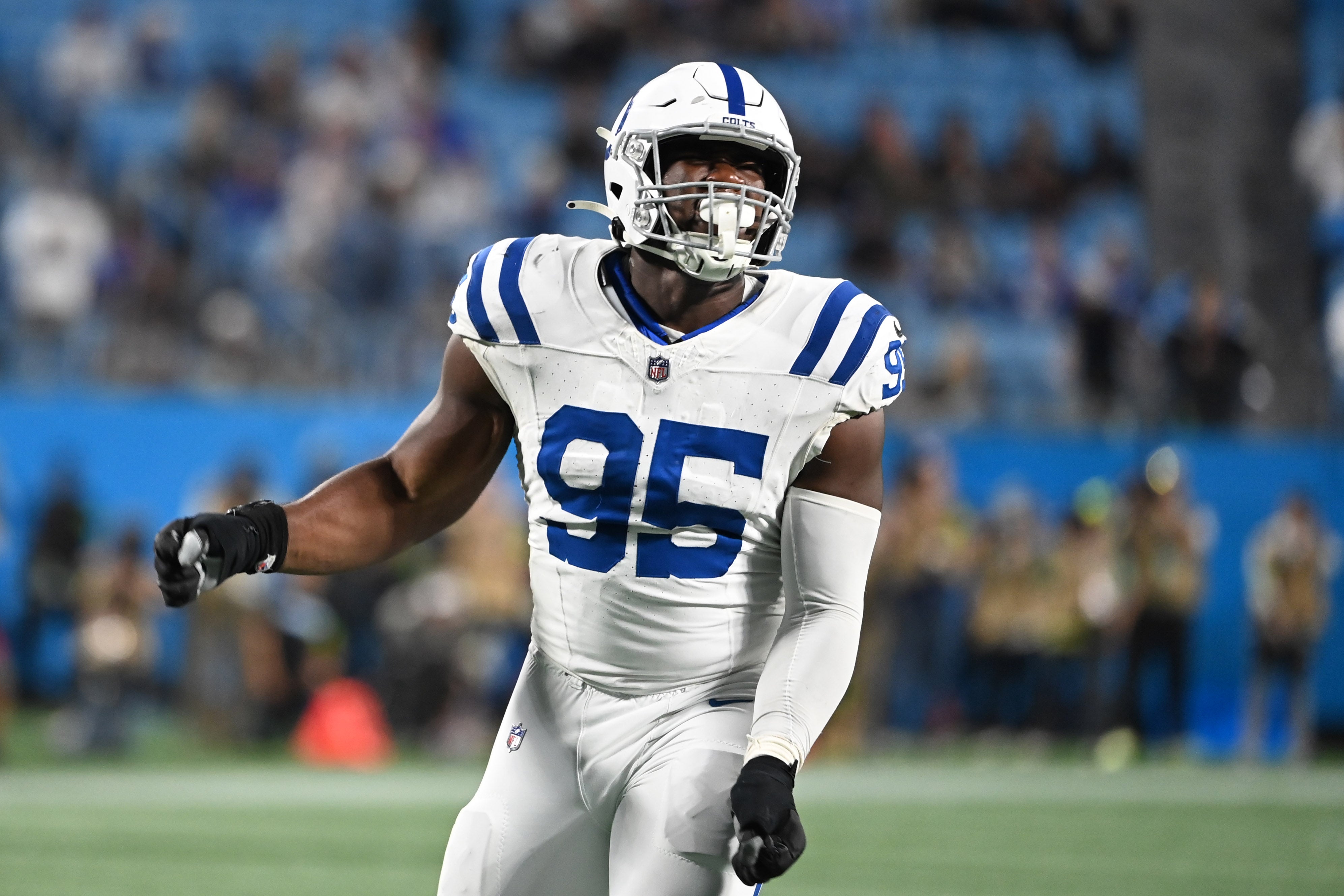 Nov 5, 2023; Charlotte, North Carolina, USA; Indianapolis Colts defensive end Adetomiwa Adebawore (95) reacts after a sack in the fourth quarter at Bank of America Stadium.