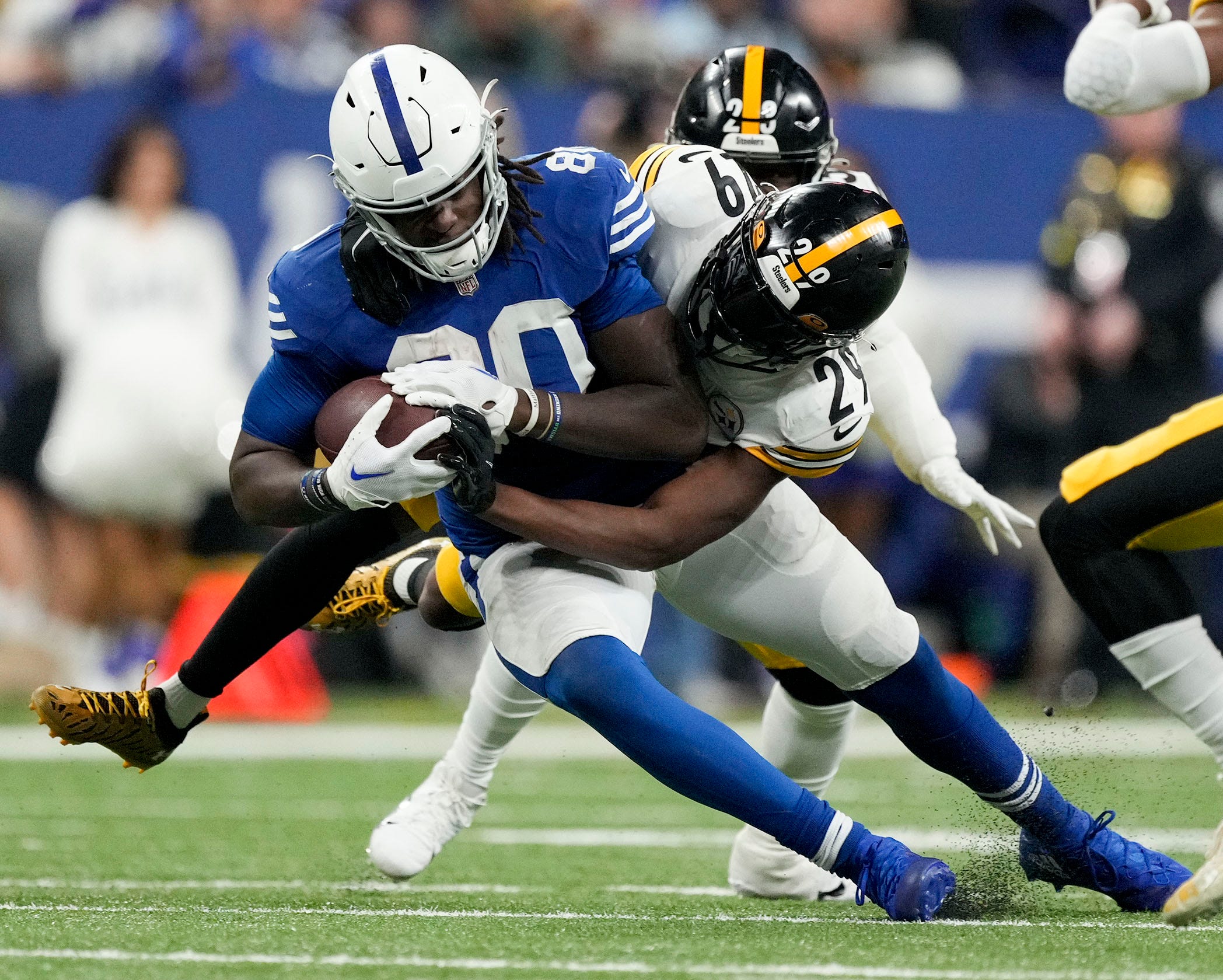 Indianapolis Colts tight end Jelani Woods (80) makes a catch in front of Pittsburgh Steelers cornerback Levi Wallace (29) on Tuesday, Nov. 29, 2022, during a game against the Pittsburgh Steelers at Lucas Oil Stadium in Indianapolis.