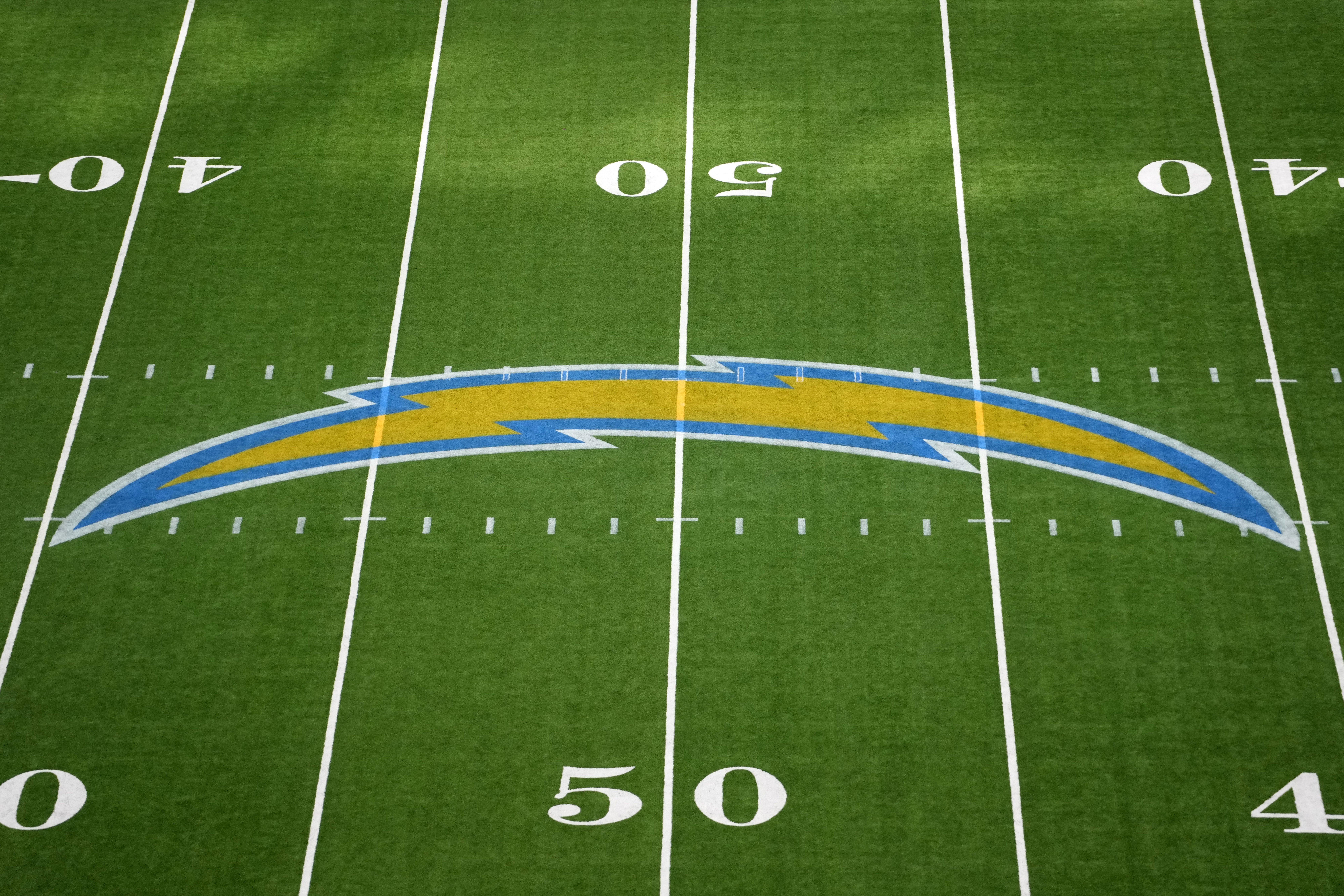 Aug 17, 2024; Inglewood, California, USA; The Los Angeles Chargers bolt logo at midfield at SoFi Stadium