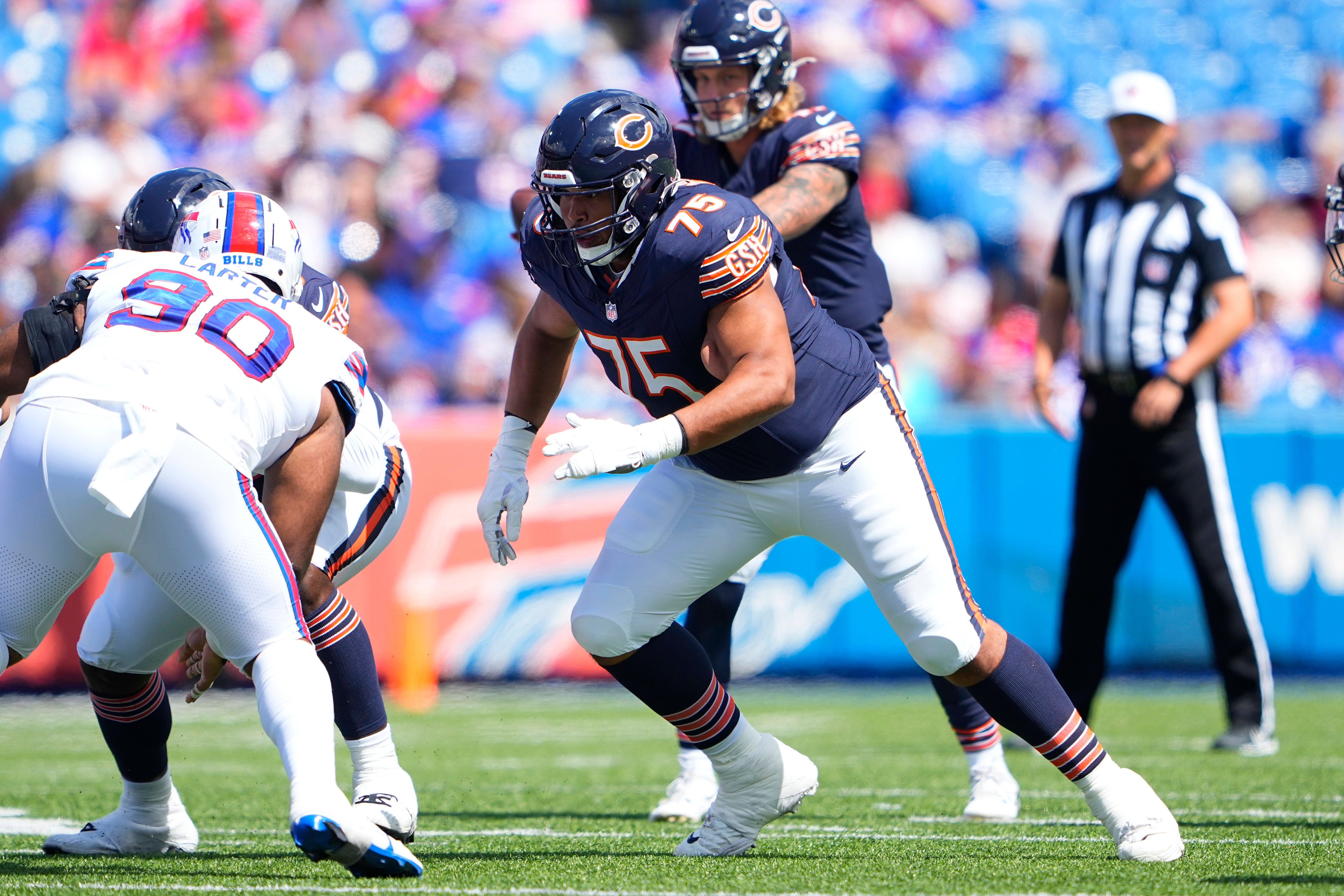 Aug 10, 2024; Orchard Park, New York, USA; Chicago Bears offensive tackle Larry Borom (75) looks to block against the Buffalo Bills during the second half at Highmark Stadium.