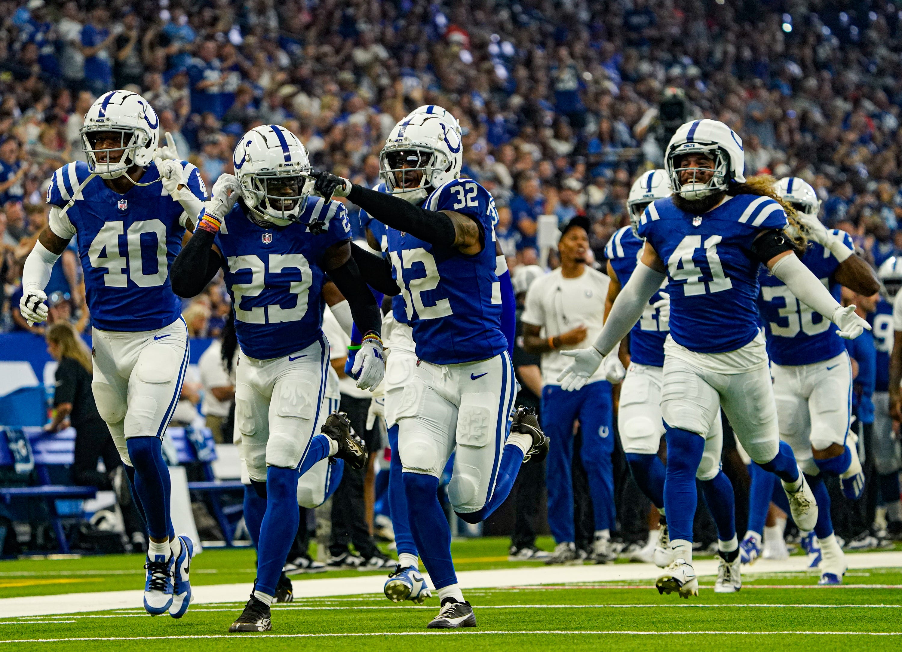 The Indianapolis Colts celebrate a play by Indianapolis Colts cornerback Kenny Moore II (23) during a pre-season game between the Indianapolis Colts and the Denver Broncos on Sunday, August. 11, 2024 at Lucas Oil Stadium in Indianapolis.
