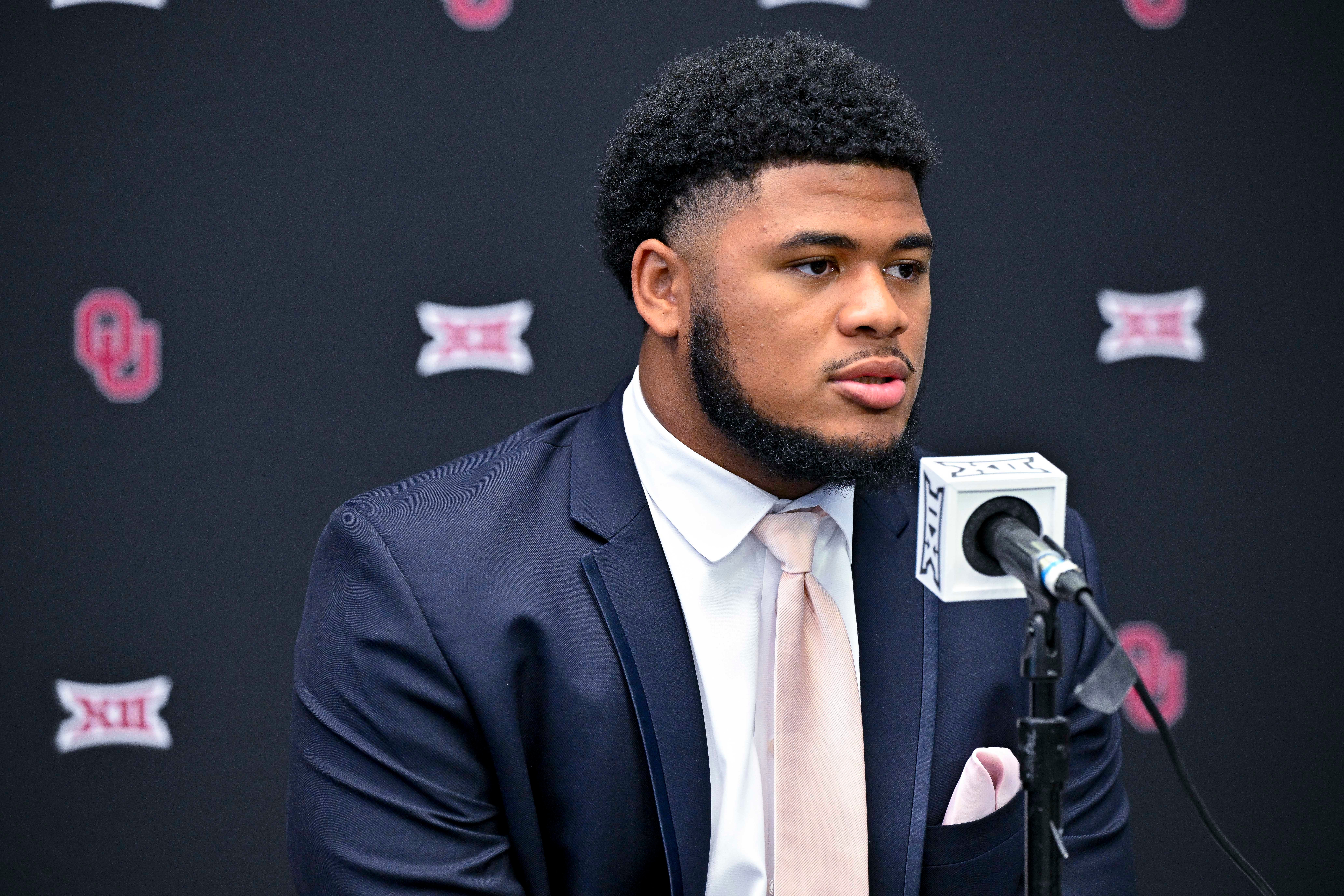 Jul 13, 2023; Arlington, TX, USA; Oklahoma Sooners defensive lineman Jonah Laulu is interviewed during the Big 12 football media day at AT&T Stadium.