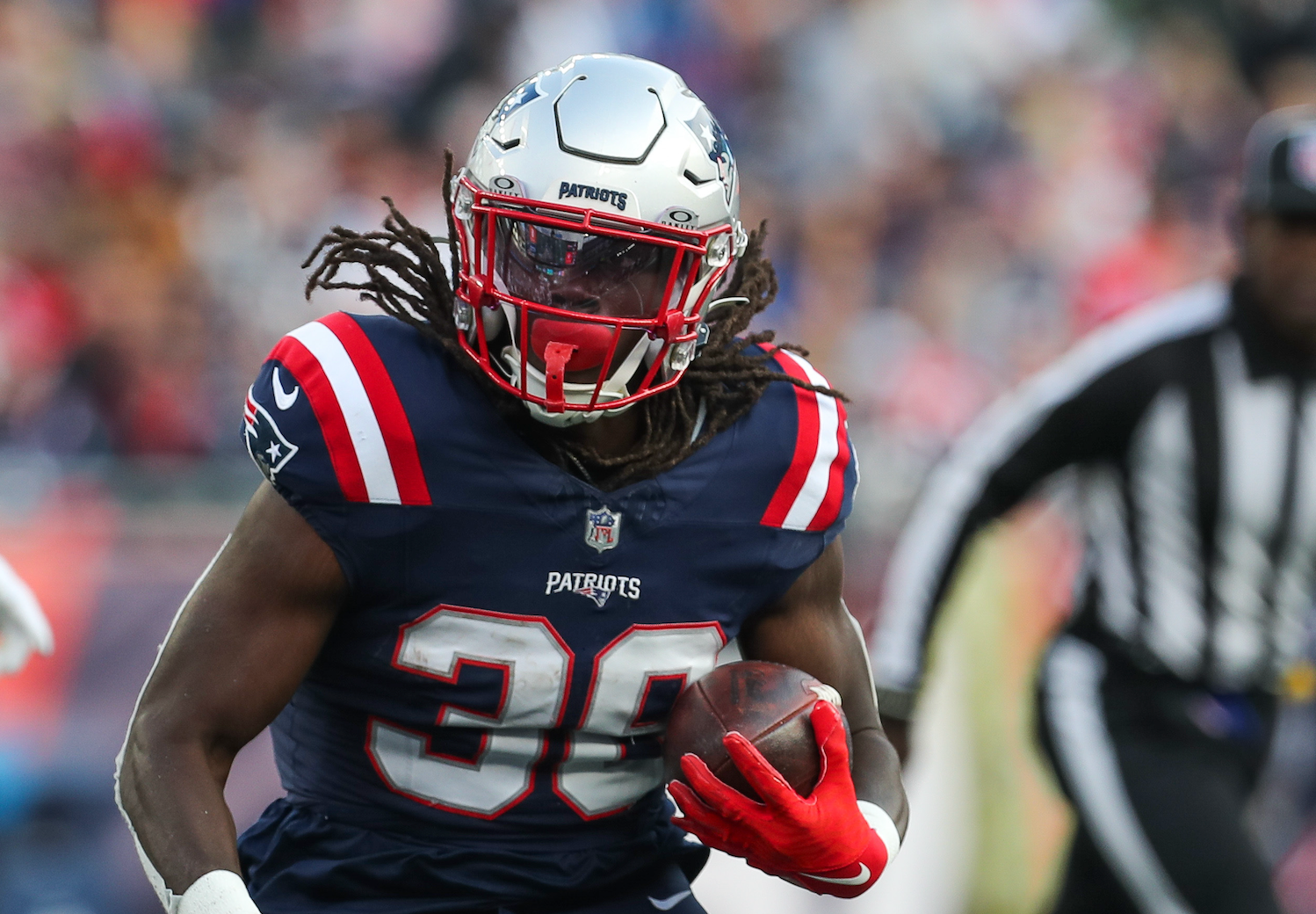 Nov 5, 2023; Foxborough, Massachusetts, USA; New England Patriots running back Rhamondre Stevenson (38) runs the ball during the second half against the Washington Commanders at Gillette Stadium