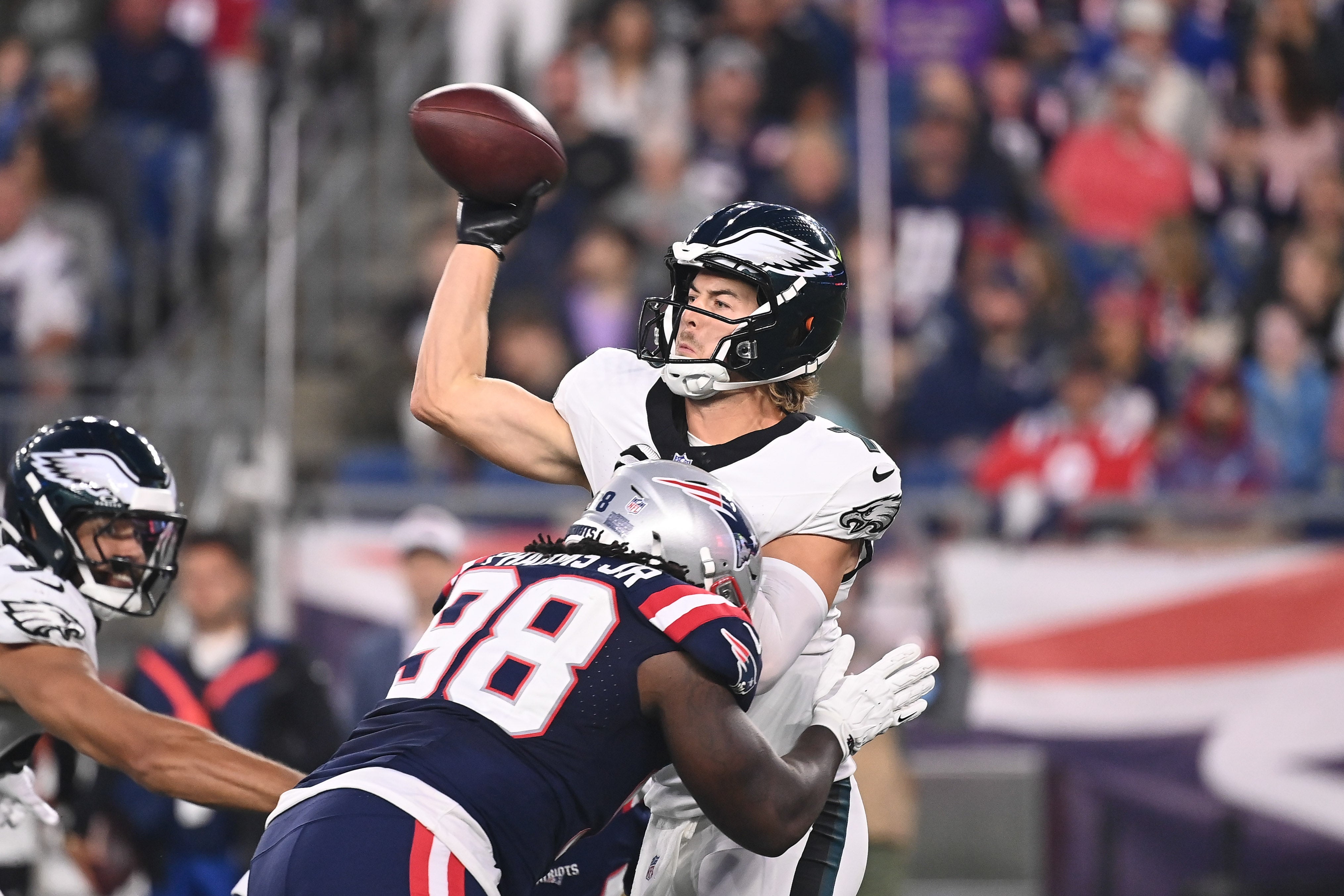 Aug 15, 2024; Foxborough, MA, USA; New England Patriots defensive tackle Jeremiah Pharms Jr. (98) tackles Philadelphia Eagles quarterback Kenny Pickett (7) during the first half at Gillette Stadium.