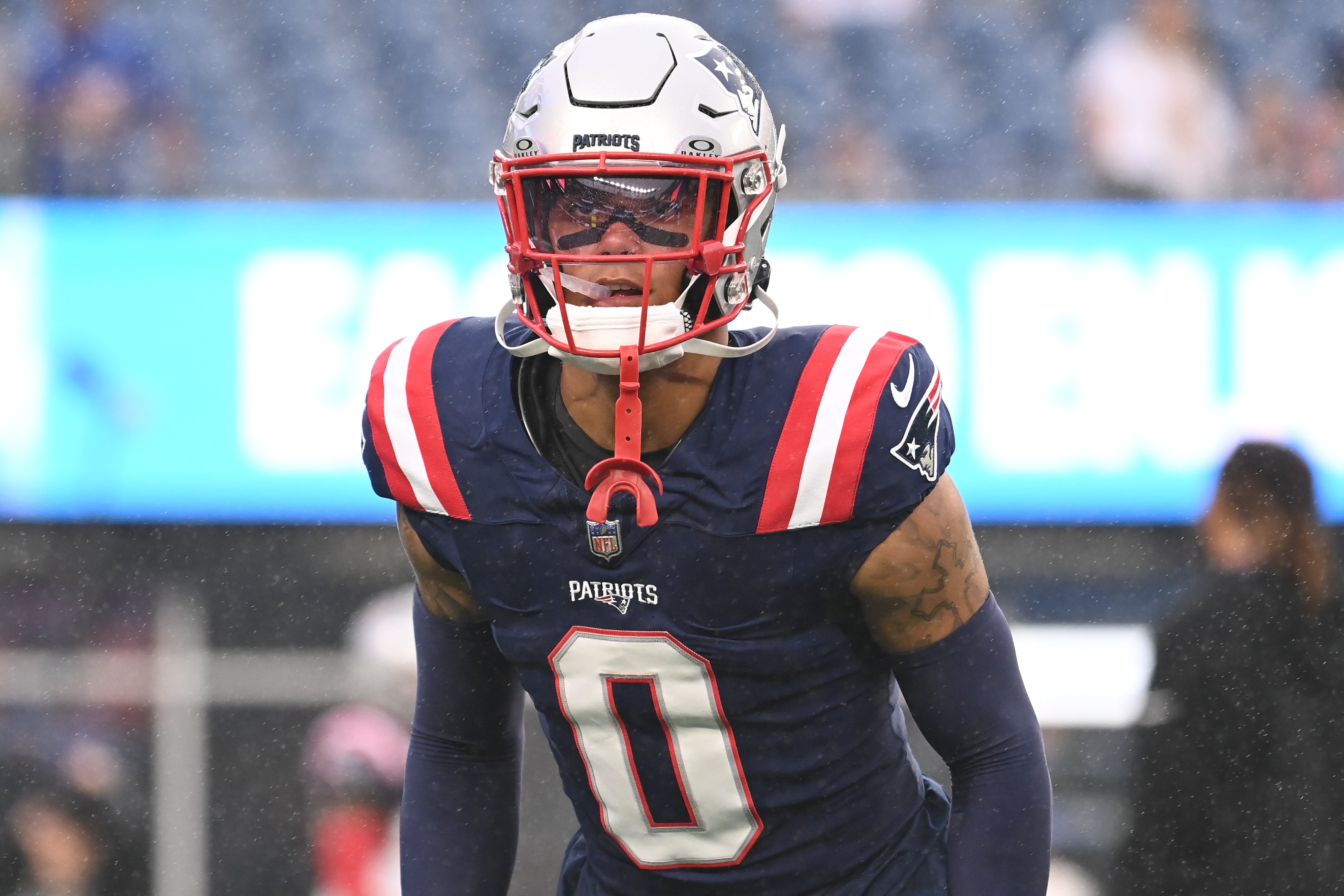 August 8, 2024; Foxborough, MA, USA; New England Patriots cornerback Christian Gonzalez (0) warms up before a game against the Carolina Panthers at Gillette Stadium.