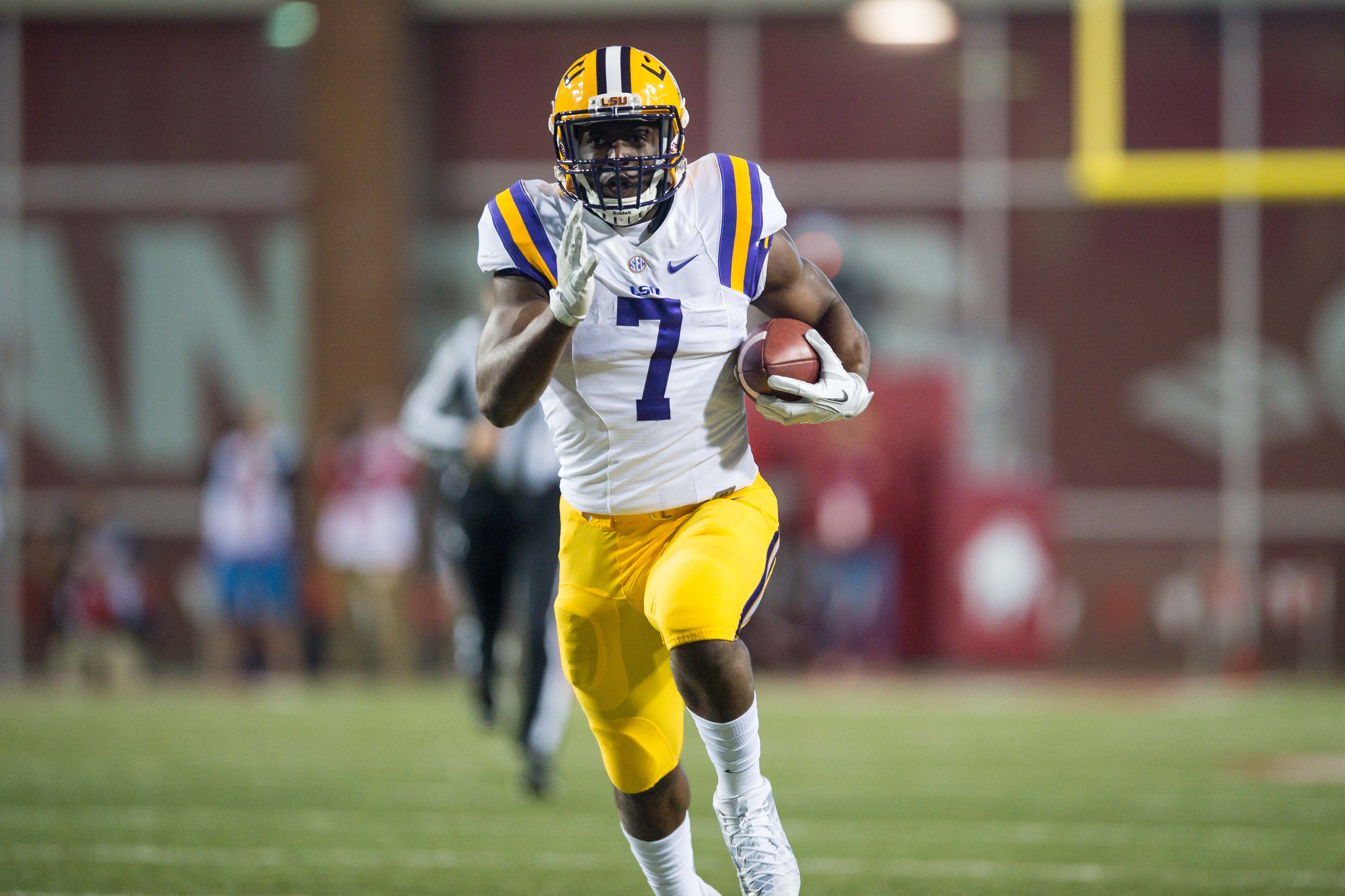 Nov 12, 2016; Fayetteville, AR, USA; LSU Tigers running back Leonard Fournette (7) runs during the first quarter of the game against the Arkansas Razorbacks at Donald W. Reynolds Razorback Stadium.
