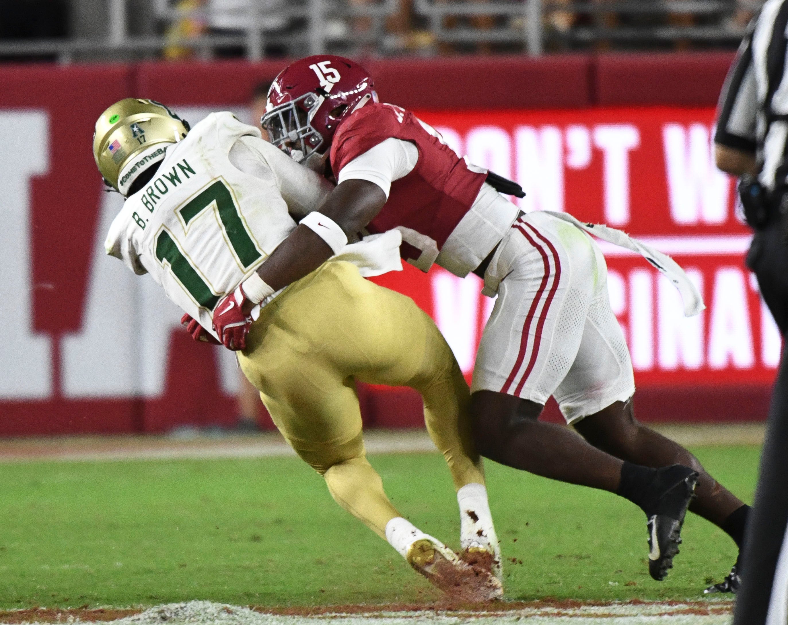 Sep 7, 2024; Tuscaloosa, Alabama, USA; Alabama Crimson Tide linebacker Justin Jefferson (15) tackles South Florida Bulls quarterback Byrum Brown (17) at Bryant-Denny Stadium. Jefferson was called for targeting on the play. Alabama won 42-16. Mandatory Credit: Gary Cosby Jr.-Imagn Images