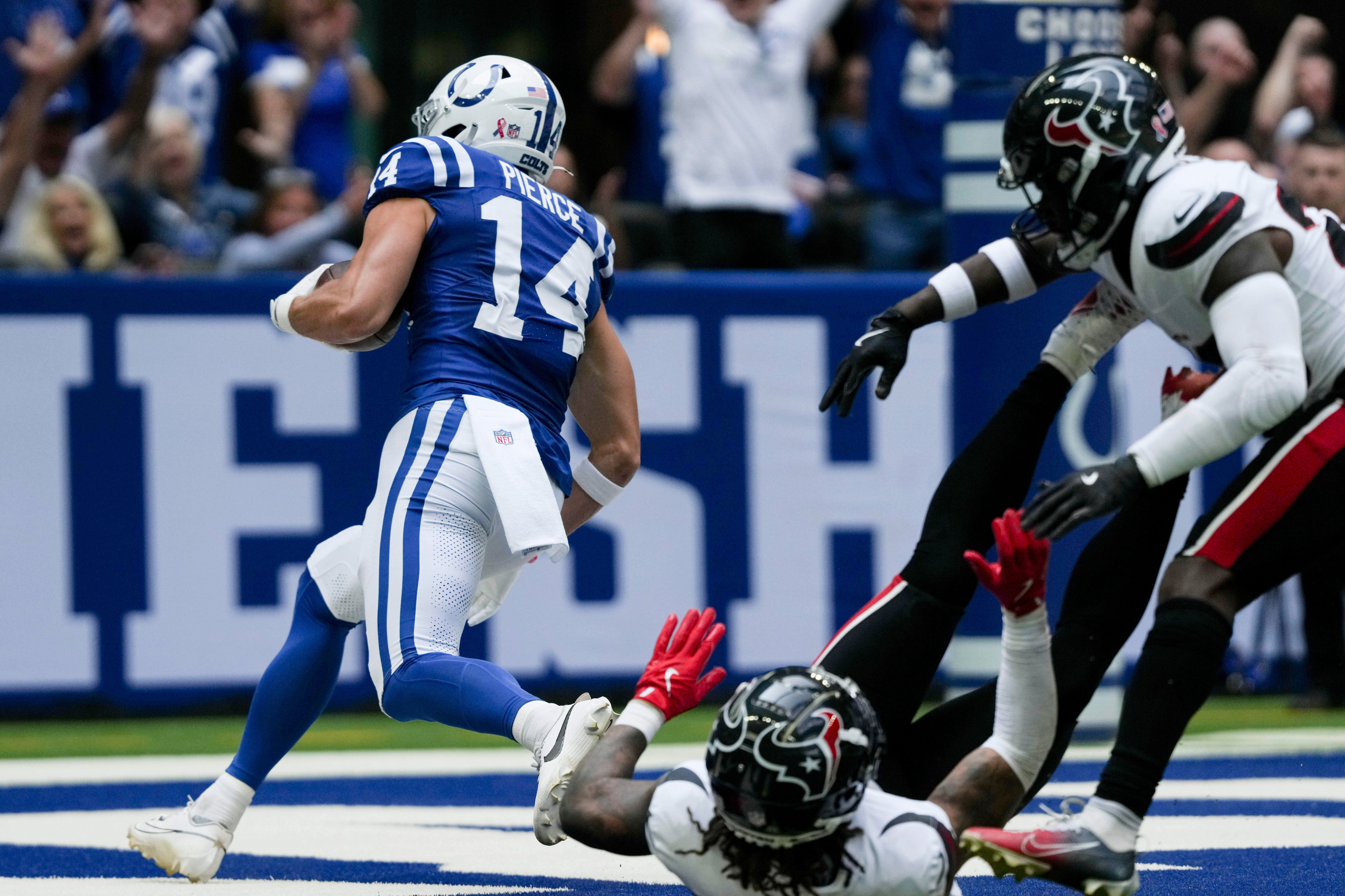 Sep 8, 2024; Indianapolis, Indiana, USA; Indianapolis Colts wide receiver Alec Pierce (14) catches a pass in the end zone for a touchdown at Lucas Oil Stadium.