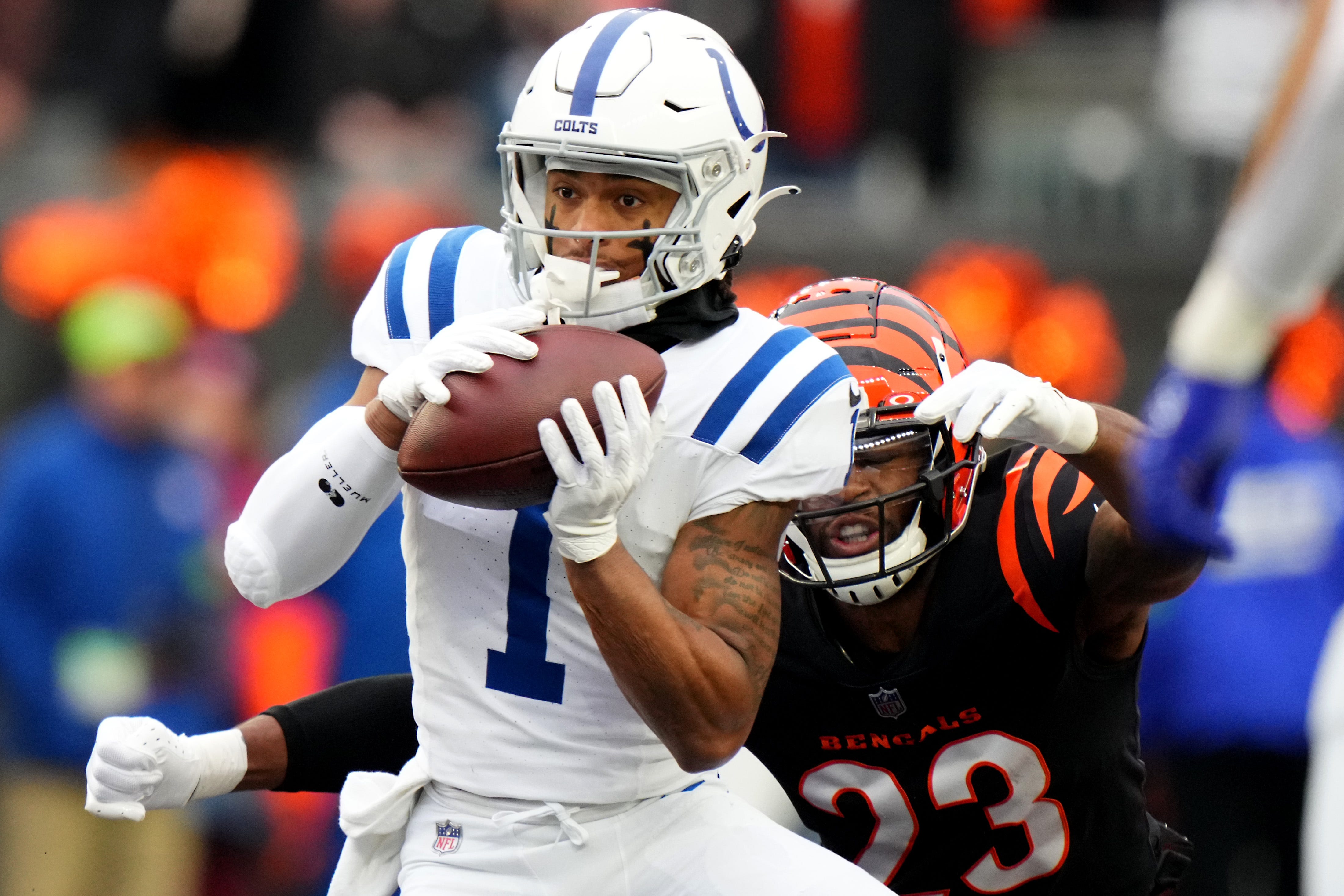 Indianapolis Colts wide receiver Josh Downs (1) completes a catch as Indianapolis Colts cornerback Kenny Moore II (23) defends in the first quarter during a Week 14 NFL game between the Indianapolis Colts and the Cincinnati Bengals, Sunday, Dec. 10, 2023, at Paycor Stadium in Cincinnati.