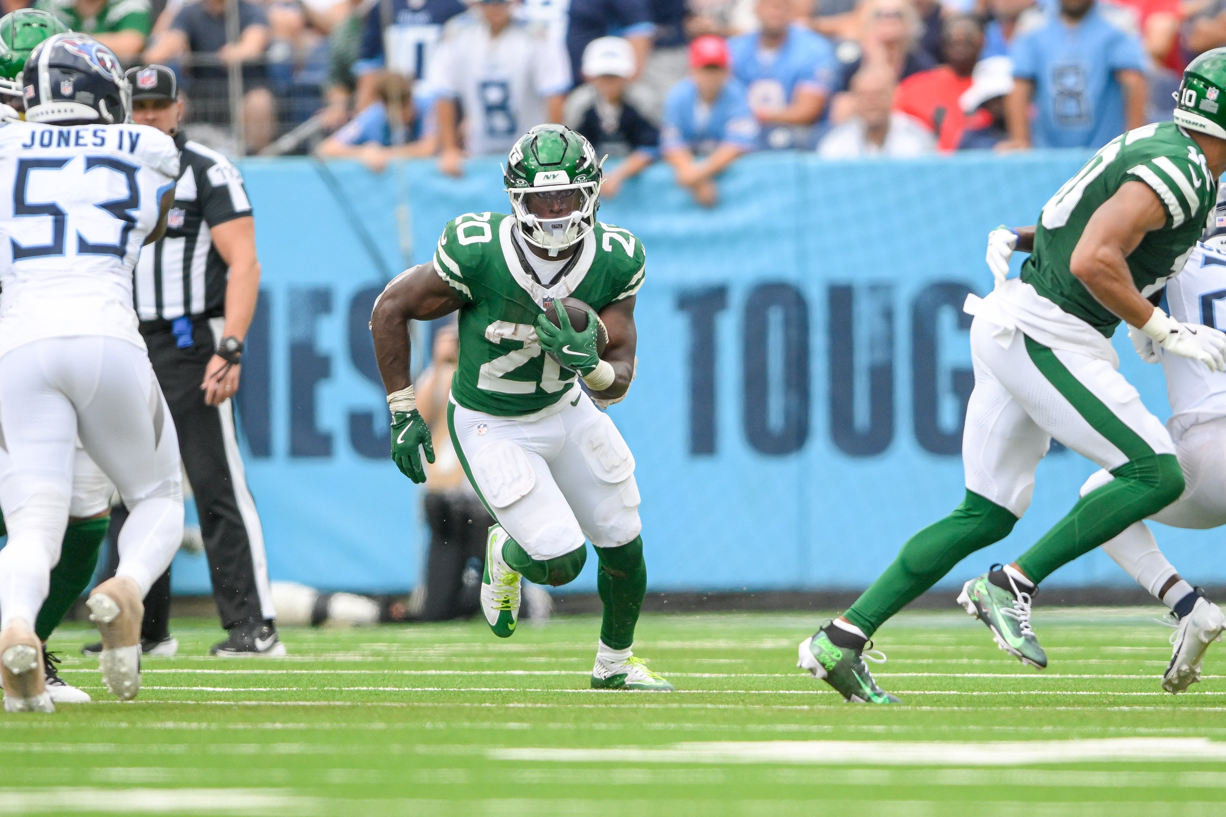 Sep 15, 2024; Nashville, Tennessee, USA; New York Jets running back Breece Hall (20) runs the ball against the New York Jets during the second half at Nissan Stadium.