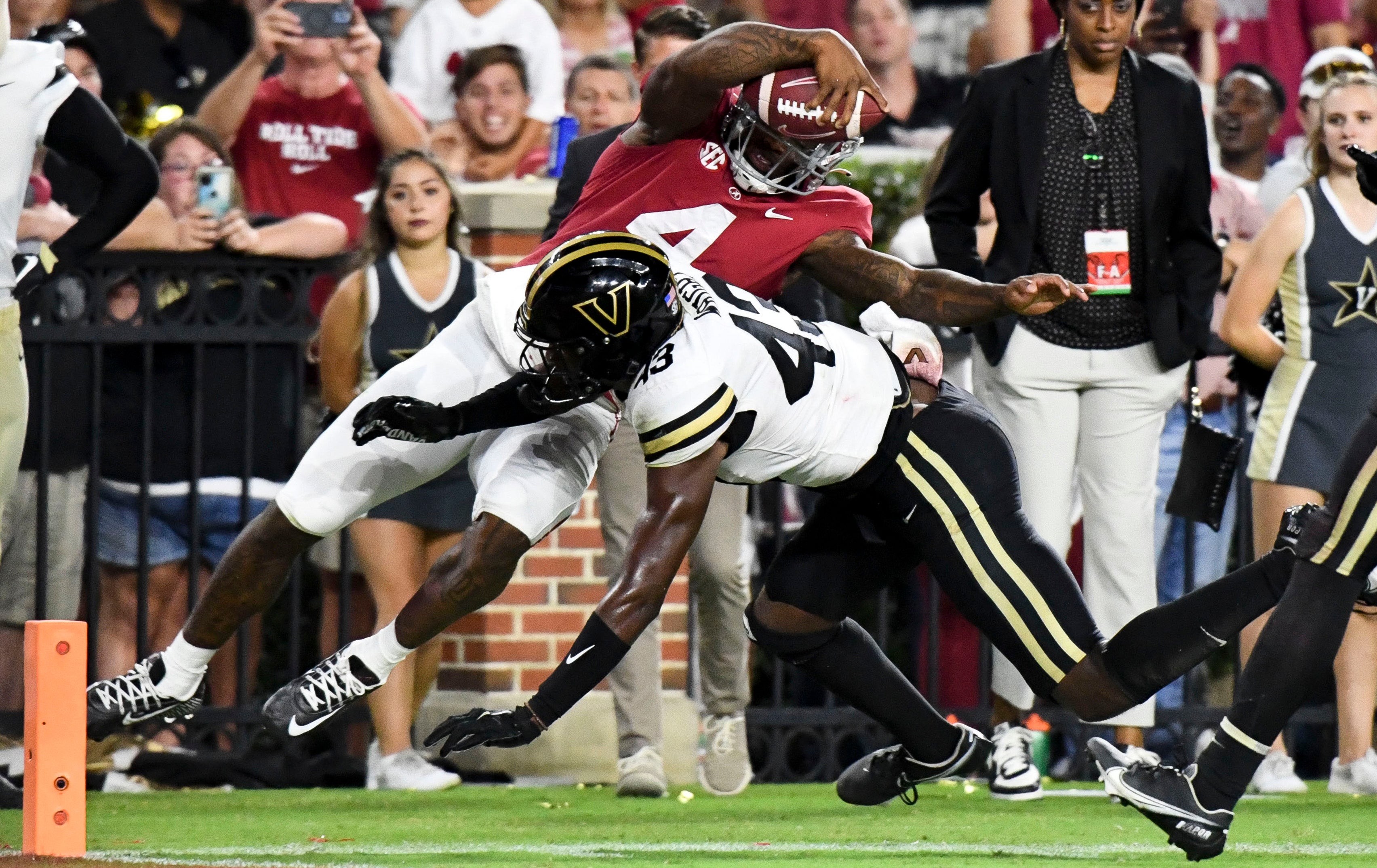 Sep 24, 2022; Tuscaloosa, Alabama, USA; Vanderbilt Commodores linebacker De'Rickey Wright (43) drives Alabama Crimson Tide quarterback Jalen Milroe (4) out of bounds short of the goal line at Bryant-Denny Stadium. Alabama won 55-3.