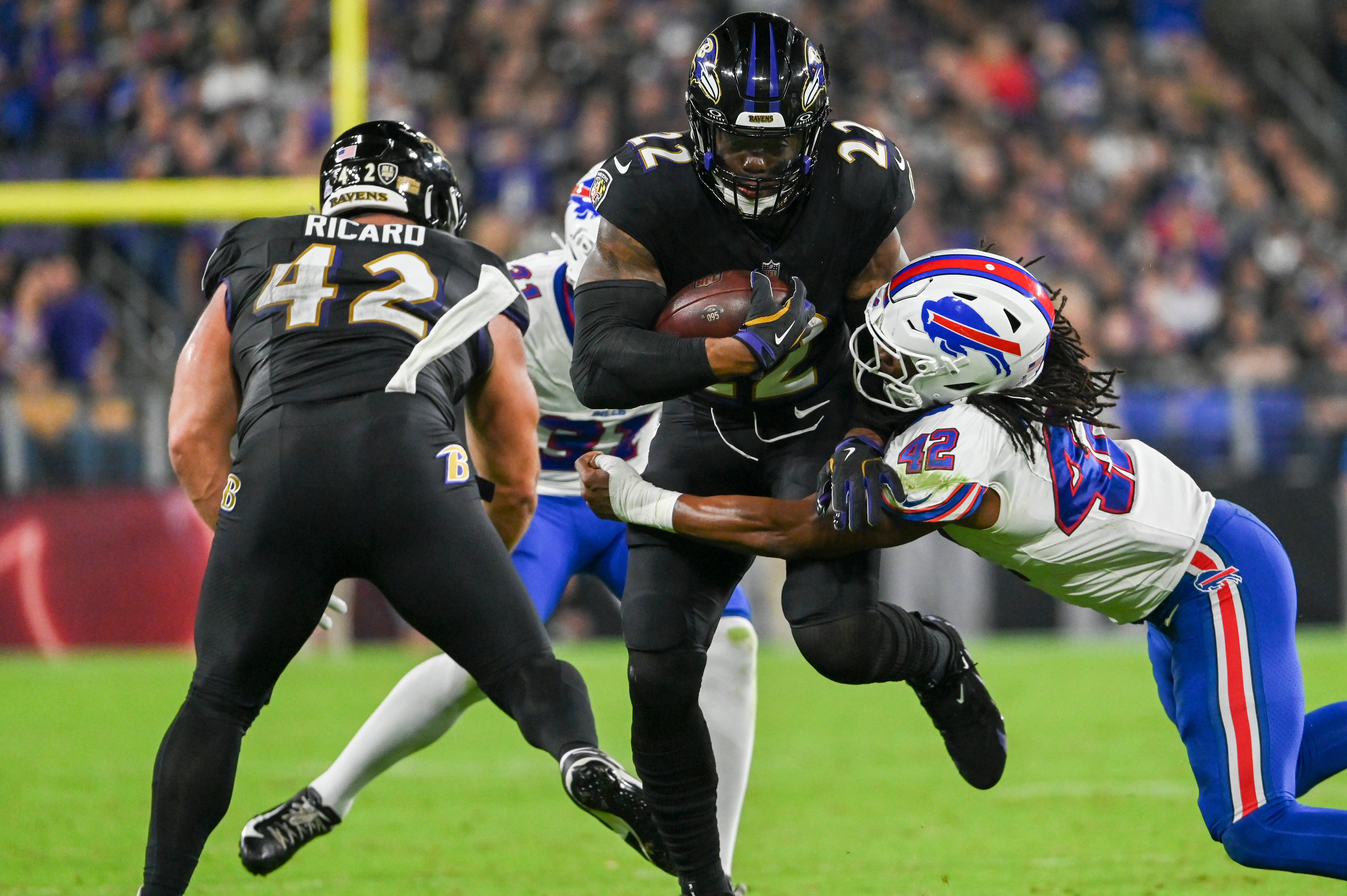 Ravens running back Derrick Henry runs through Buffalo Bills linebacker Dorian Williams tackle attempt.