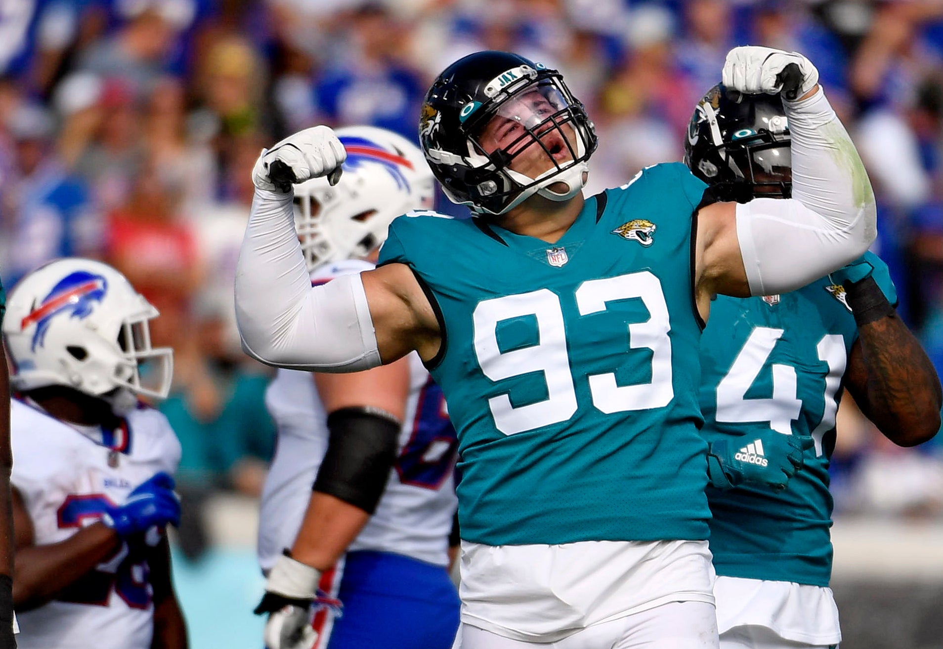 Nov 7, 2021; Jacksonville, Florida, USA; Jacksonville Jaguars defensive lineman Taven Bryan (93) celebrates after a play during the first half against the Buffalo Bills at TIAA Bank Field.