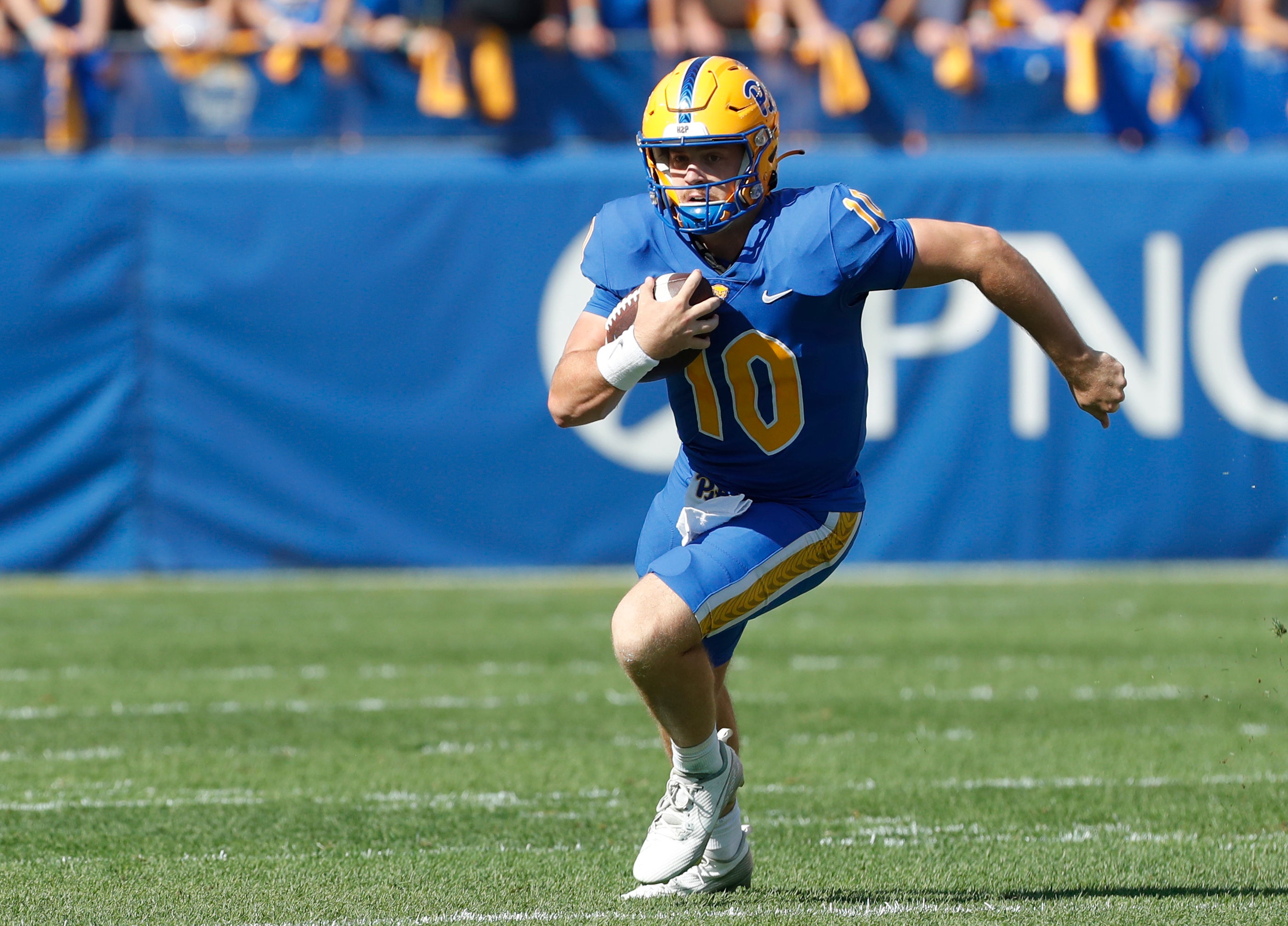 Sep 21, 2024; Pittsburgh, Pennsylvania, USA; Pittsburgh Panthers quarterback Eli Holstein (10) runs with the ball against the Youngstown State Penguins during the first quarter at Acrisure Stadium.