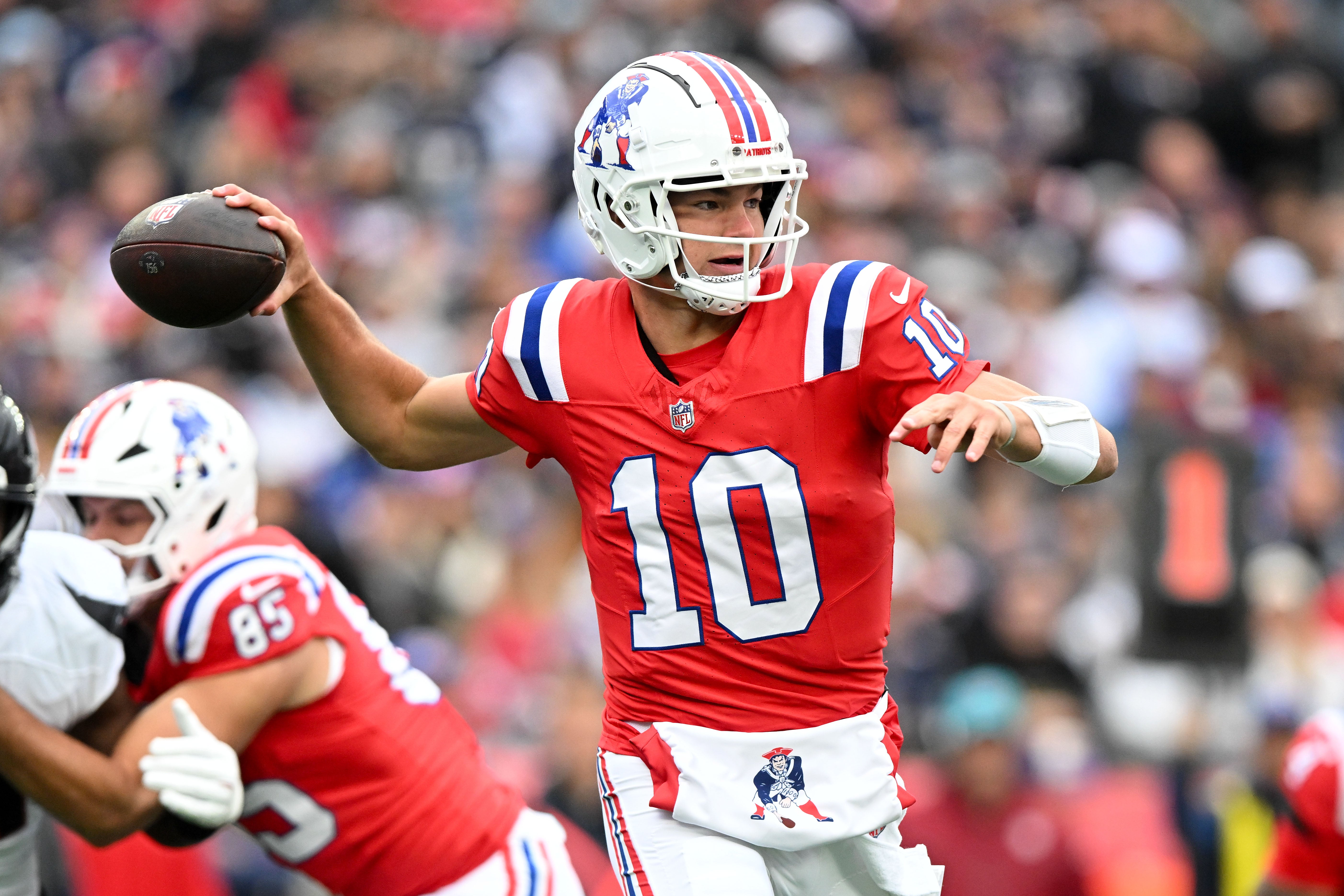 ct 13, 2024; Foxborough, Massachusetts, USA; New England Patriots quarterback Drake Maye (10) looks to throw against the Houston Texans during the first half at Gillette Stadium.