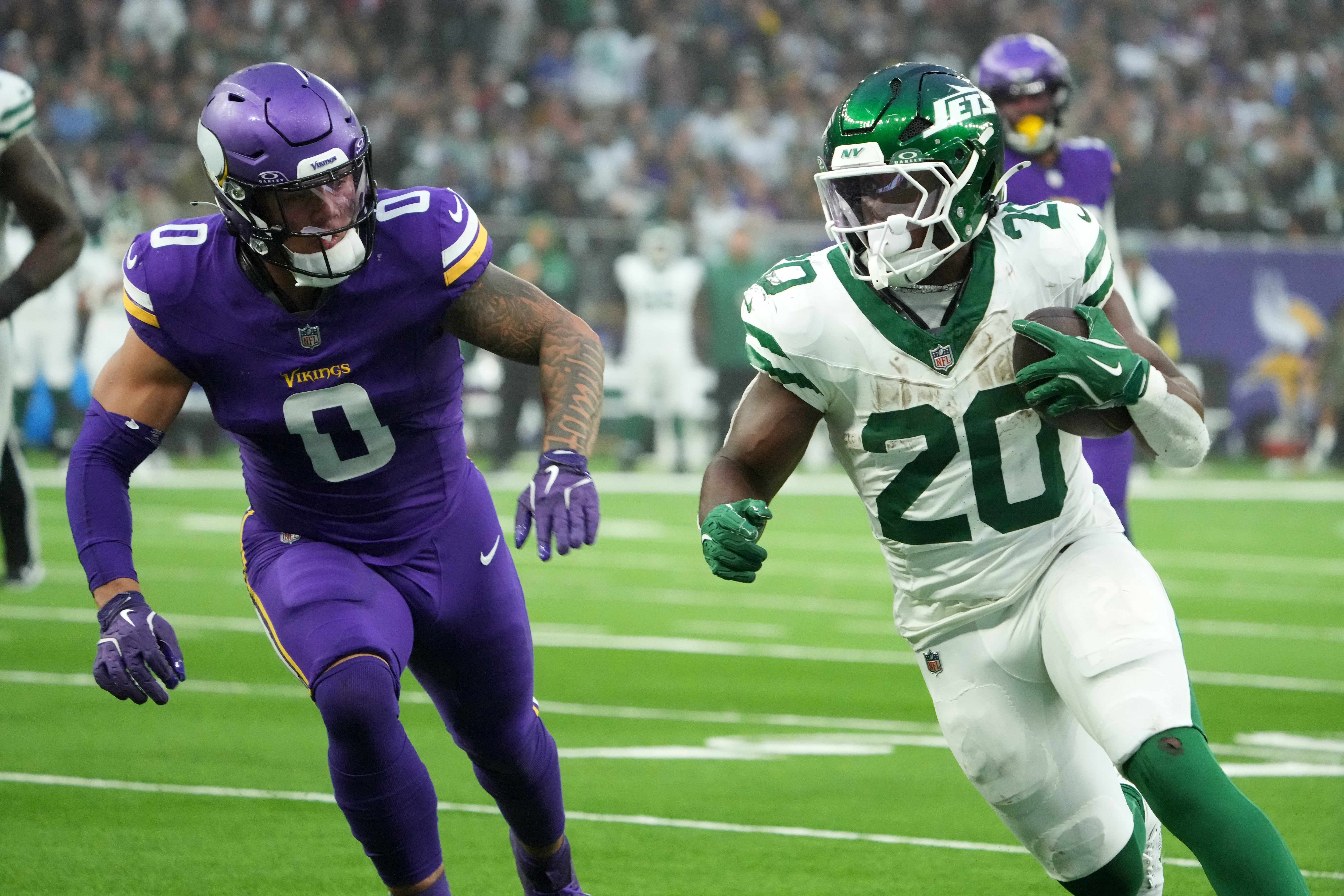 Oct 6, 2024; London, United Kingdom; New York Jets running back Breece Hall (20) carries the ball against Minnesota Vikings linebacker Ivan Pace Jr. (0) in the second half at Tottenham Hotspur Stadium.