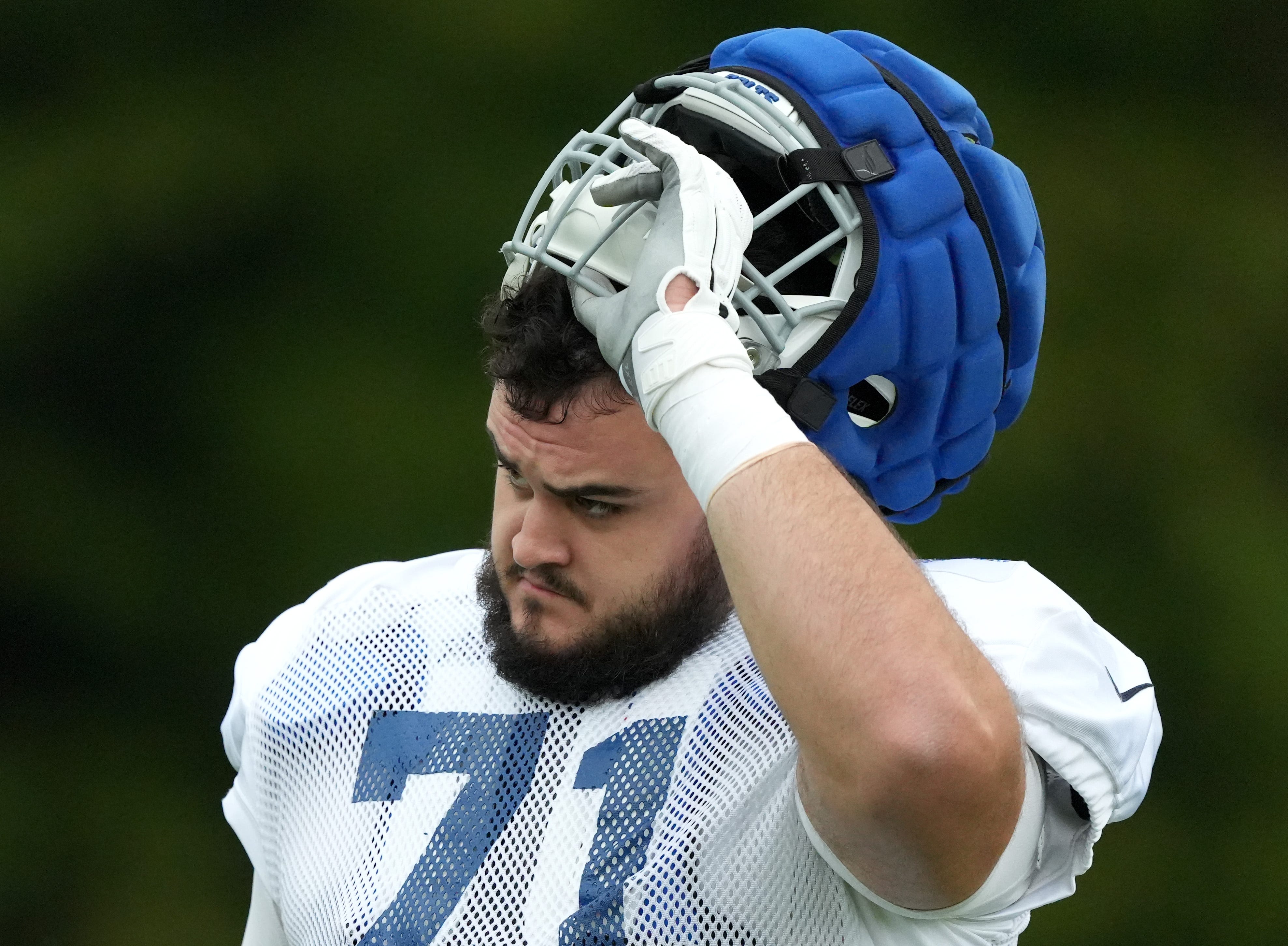 Indianapolis Colts offensive tackle Matt Goncalves (71) puts on his helmet during a joint practice with the Arizona Cardinals on Thursday, Aug. 15, 2024, at Grand Park Sports Complex in Westfield.  