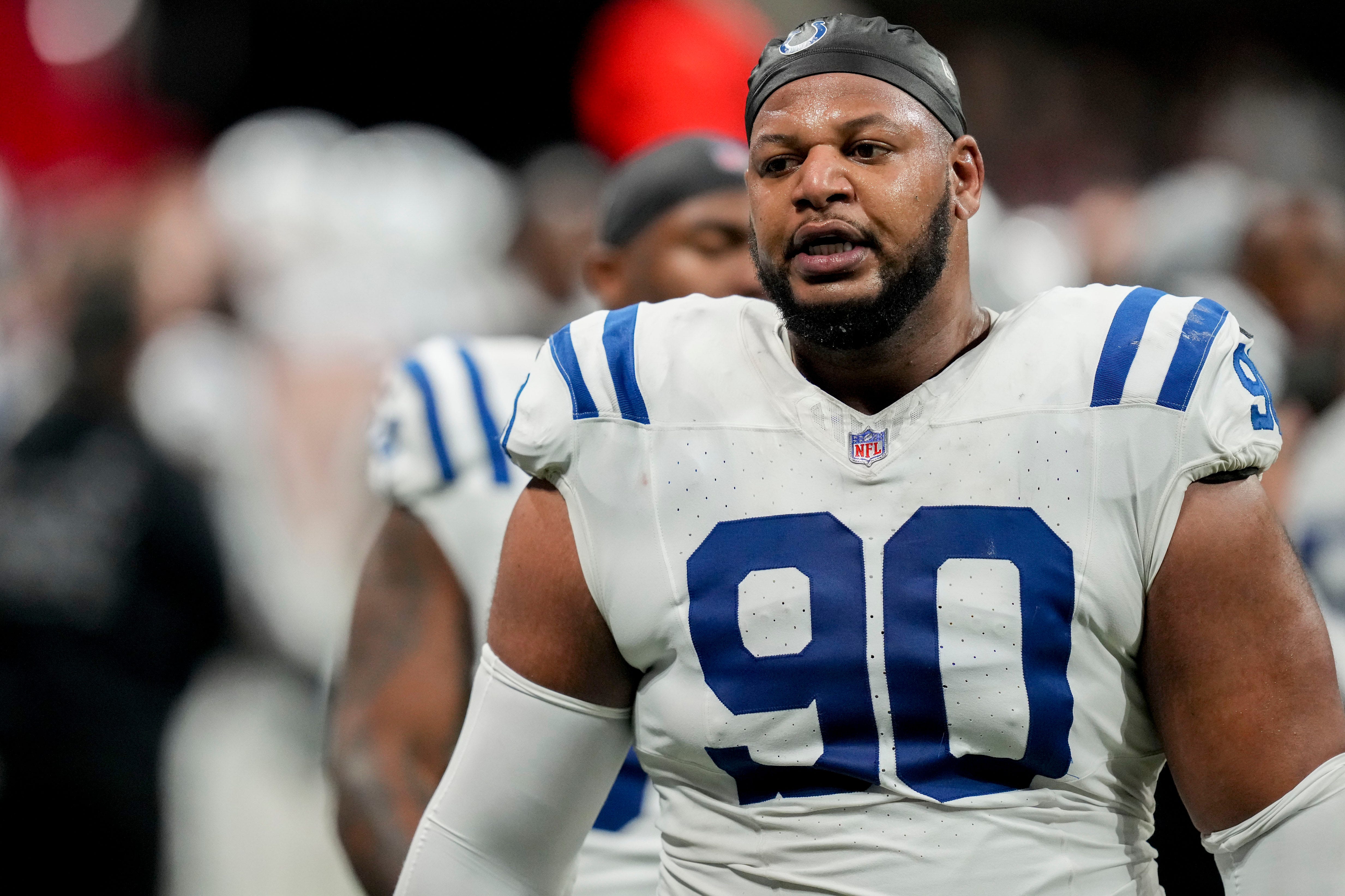 Indianapolis Colts defensive tackle Grover Stewart (90) walks the sideline Sunday, Dec. 24, 2023, during a game against the Atlanta Falcons at Mercedes-Benz Stadium in Atlanta.