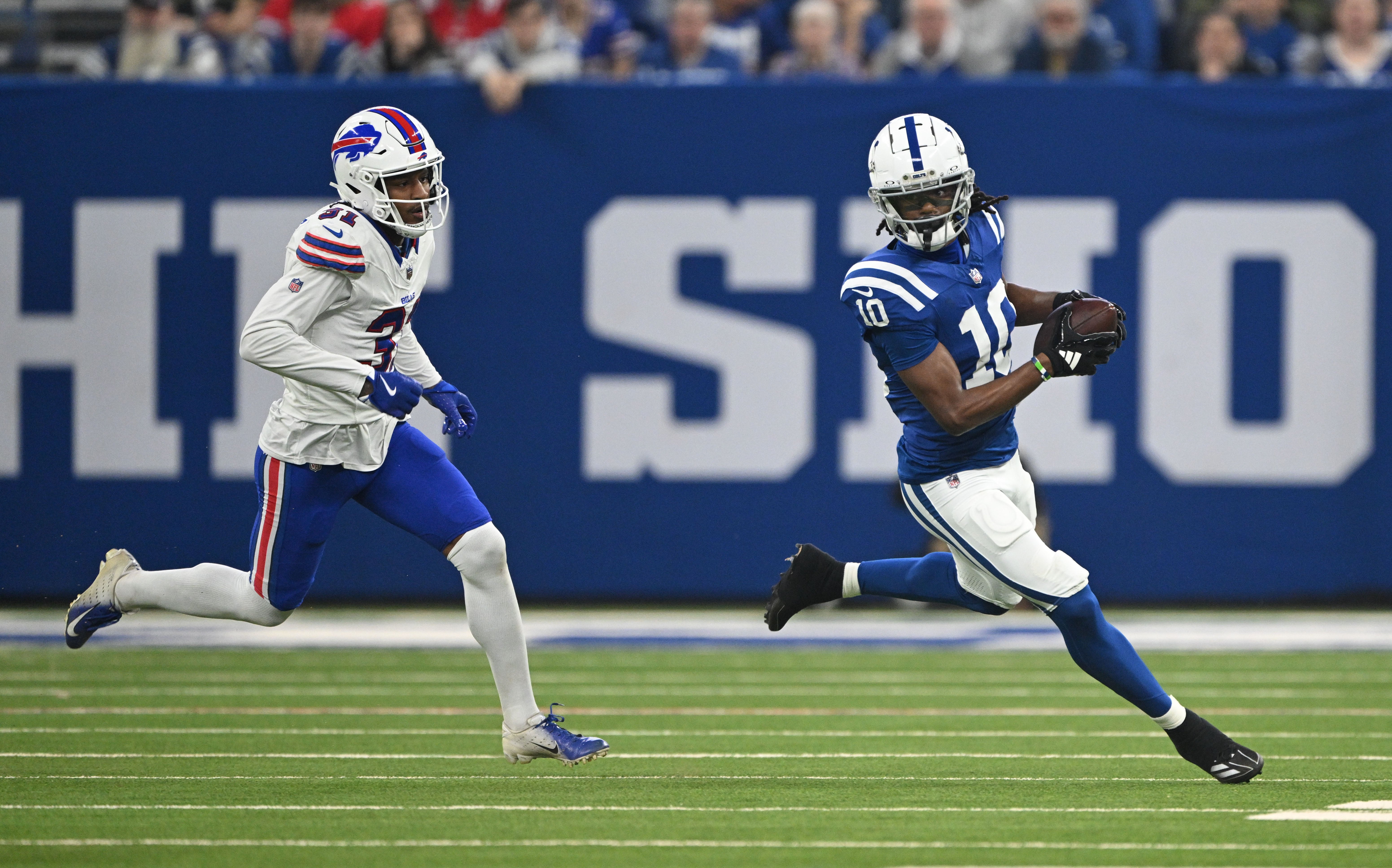 Nov 10, 2024; Indianapolis, Indiana, USA;Indianapolis Colts wide receiver Adonai Mitchell (10) runs past Buffalo Bills cornerback Rasul Douglas (31) during the second quarter at Lucas Oil Stadium.